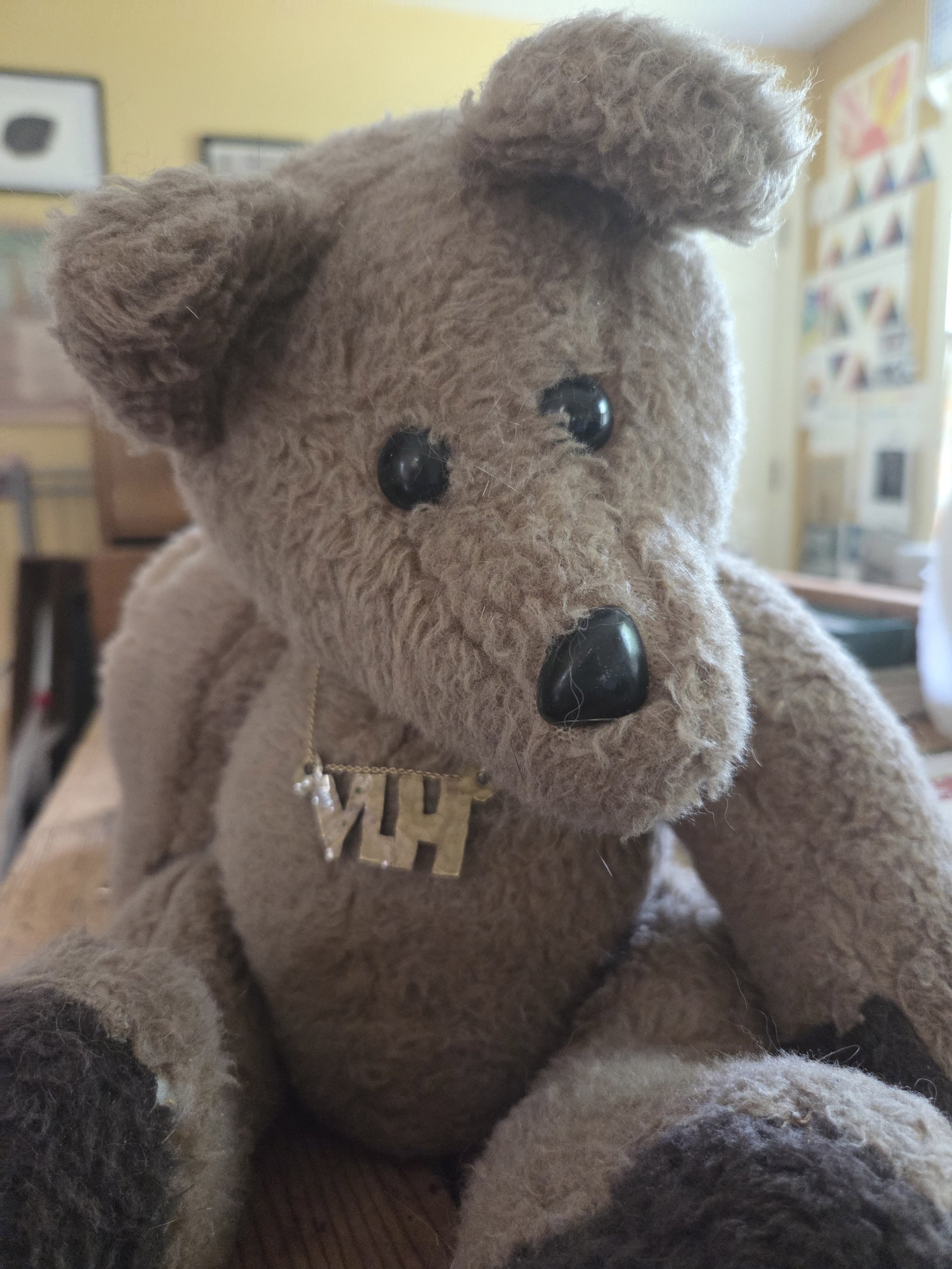 This is another bear made by Jill, wearing a necklace she made of brass - my initials - which she gave to me for Mother's Day.