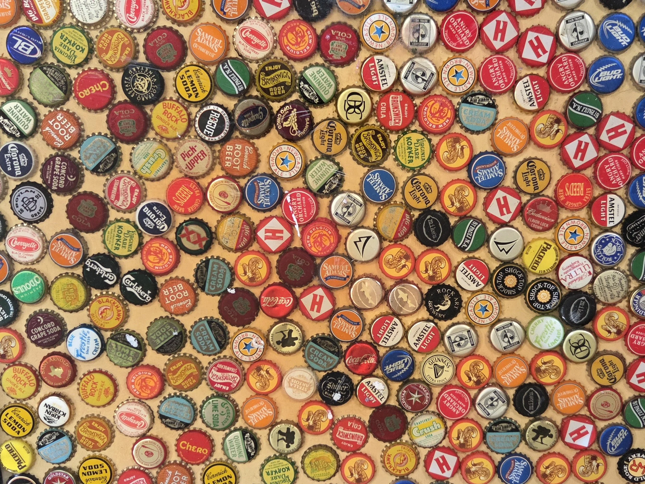 Jill collected these bottle caps and used them to create a top for an end table.