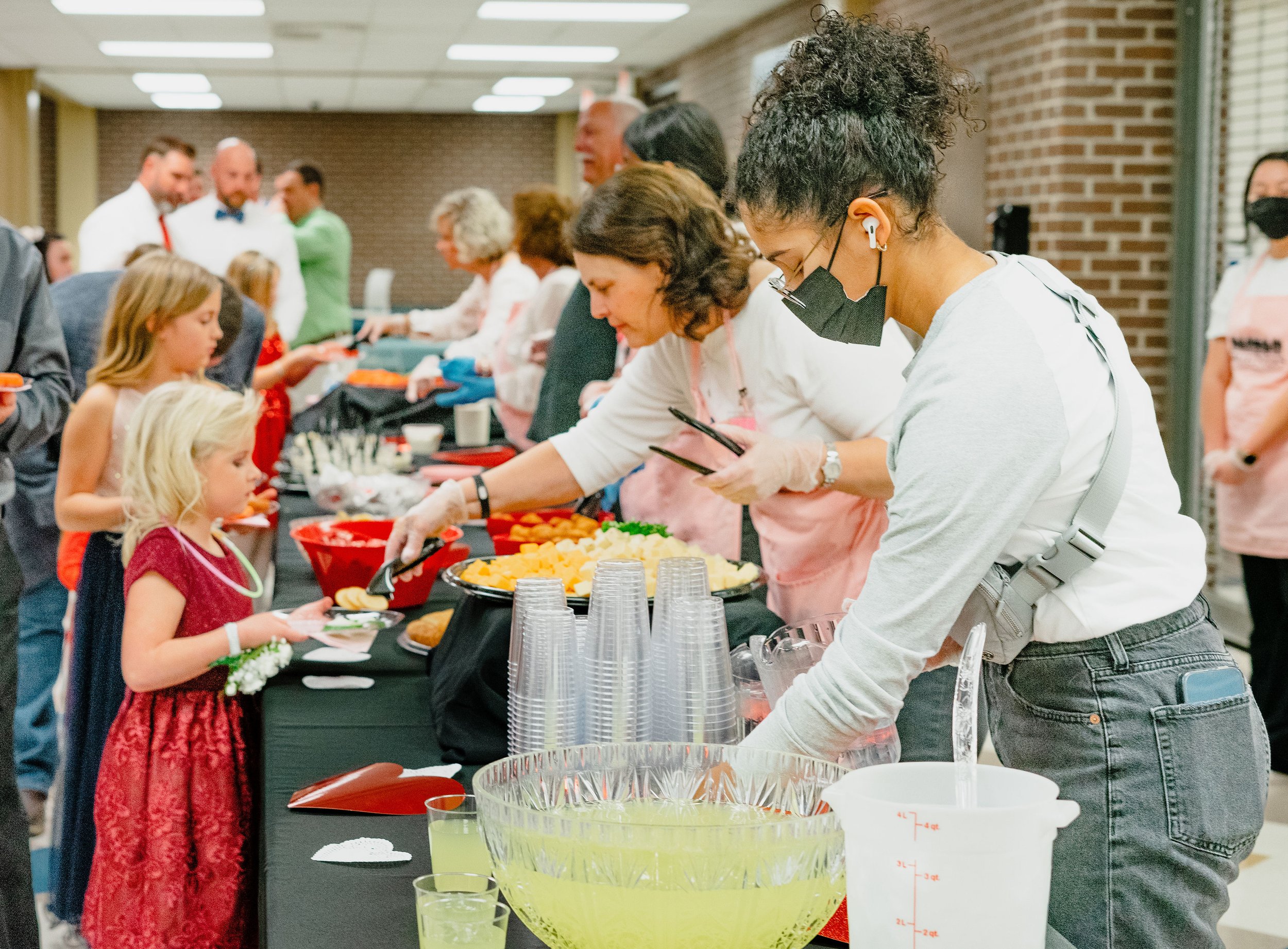 Volunteers serving daughters at FDD