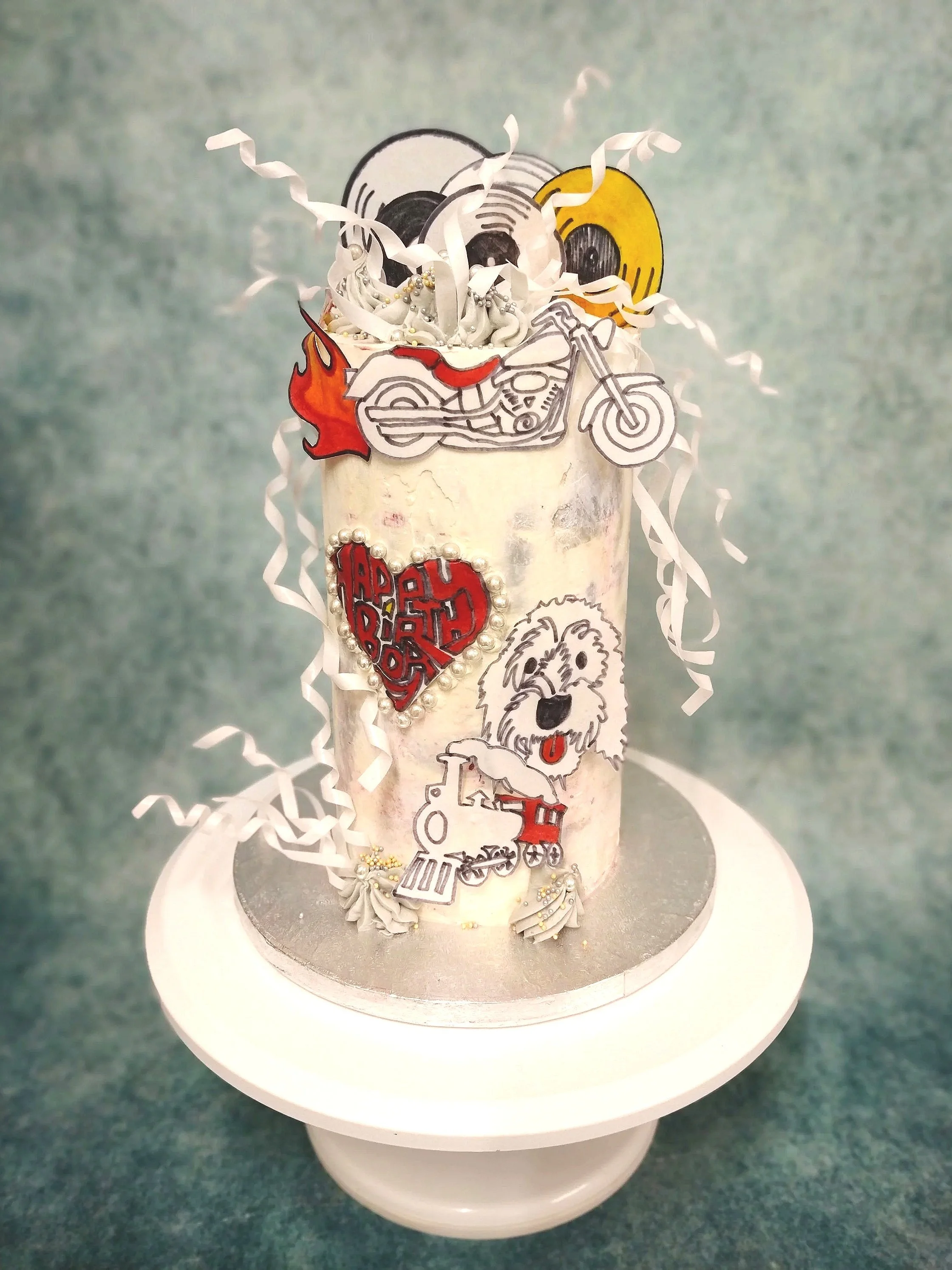 Pop art 'Rock n Roll' for a 60th birthday vinyl mad kinda guy. A fun cake showcasing some of the things he cherishes and enjoys.