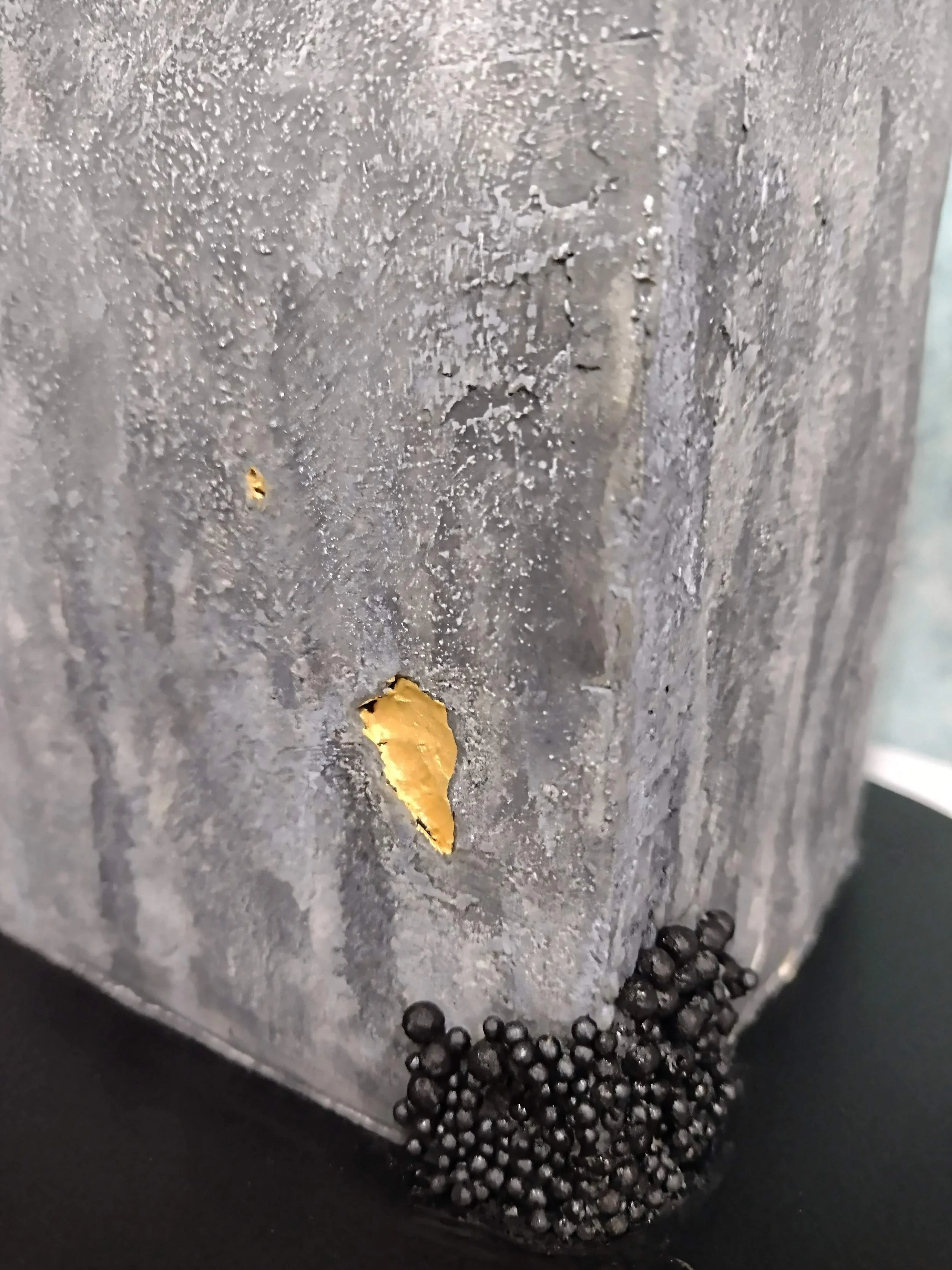 'Caviar' pearls, a hint of gold, stone texture and clean architectural lines were some of the requested elements I had for this 50th birthday cake. Natural pigments and all edible garnishes were applied to highlight these design features.