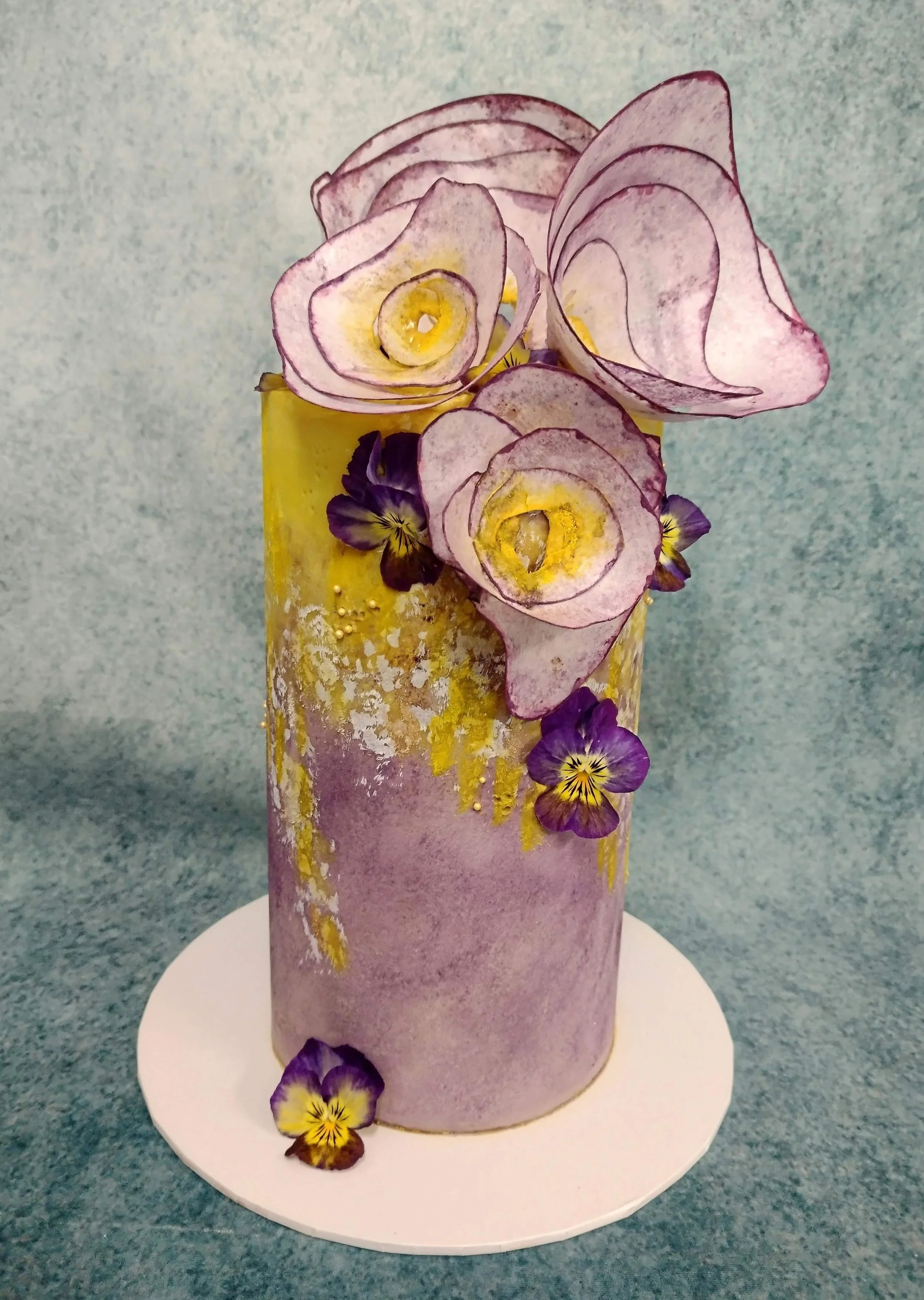 A 60th birthday cake for a friends sister in May. I was asked for a cake of tasteful simplicity - Victoria Sponge, filled with a vanilla bean buttercream and plump fruity strawberry jam. The design was to follow a theme of purple and yellow, delicate