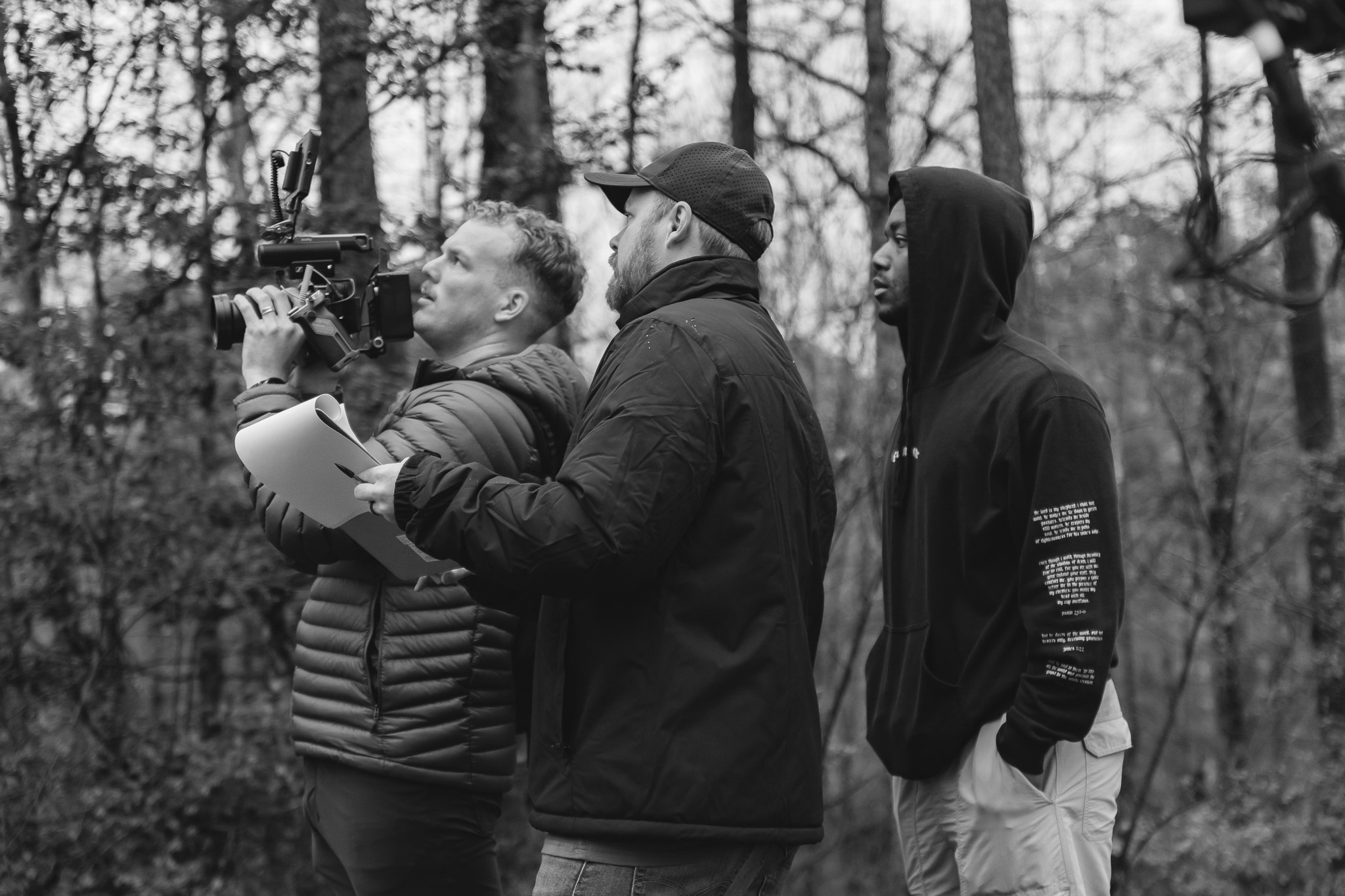 Professional film crew filming with cinema camera during outdoor video production