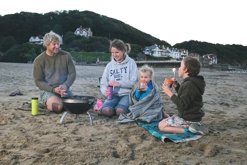 Lifestyle session example - family on beach around fire pit