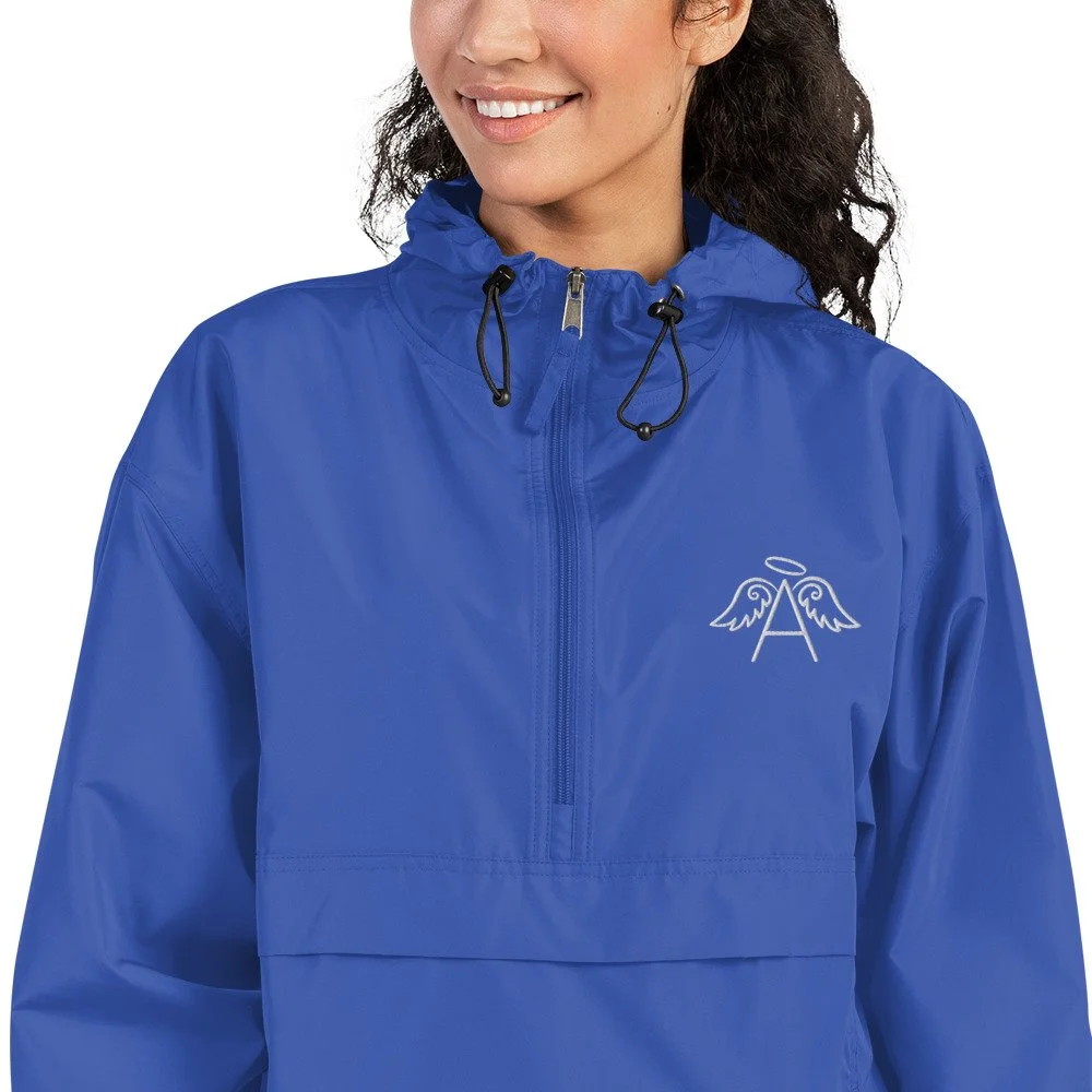 embroidered-champion-packable-jacket-royal-blue-zoomed-in-6246065d7c2e7.jpg