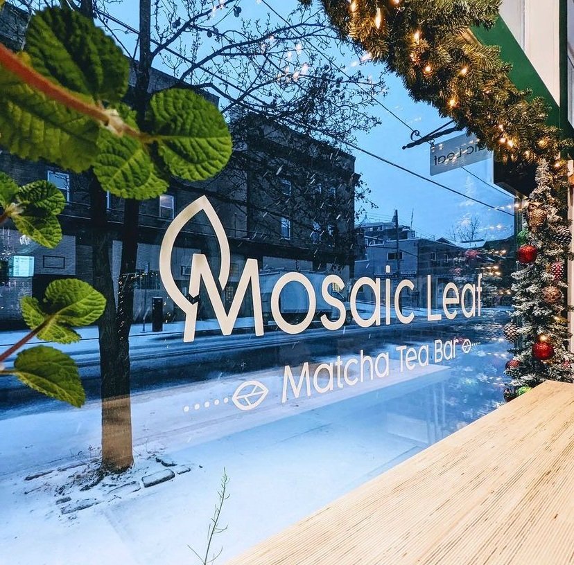 Mosaic Leaf's front window decorated for Christmas