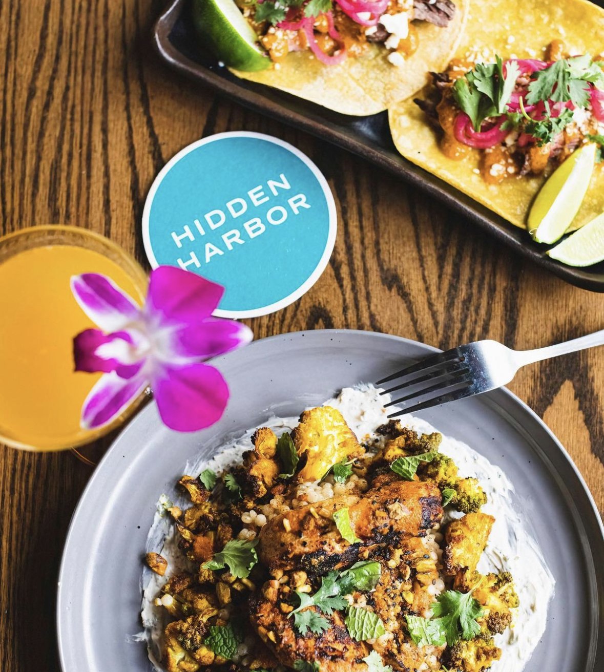 A tropical cocktail and entree from Hidden Harbor in Pittsburgh