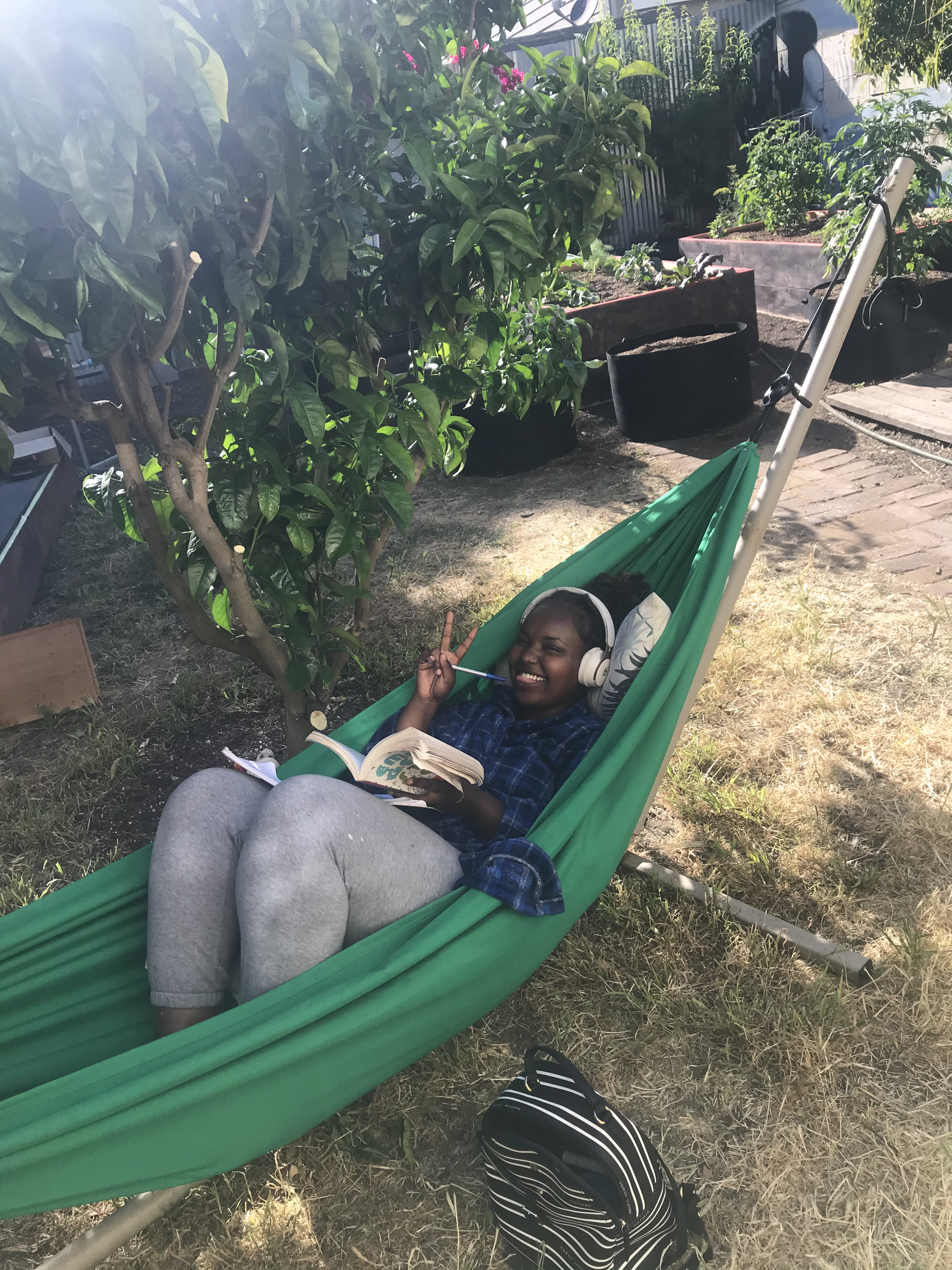 Happy hotel guest enjoying the garden 