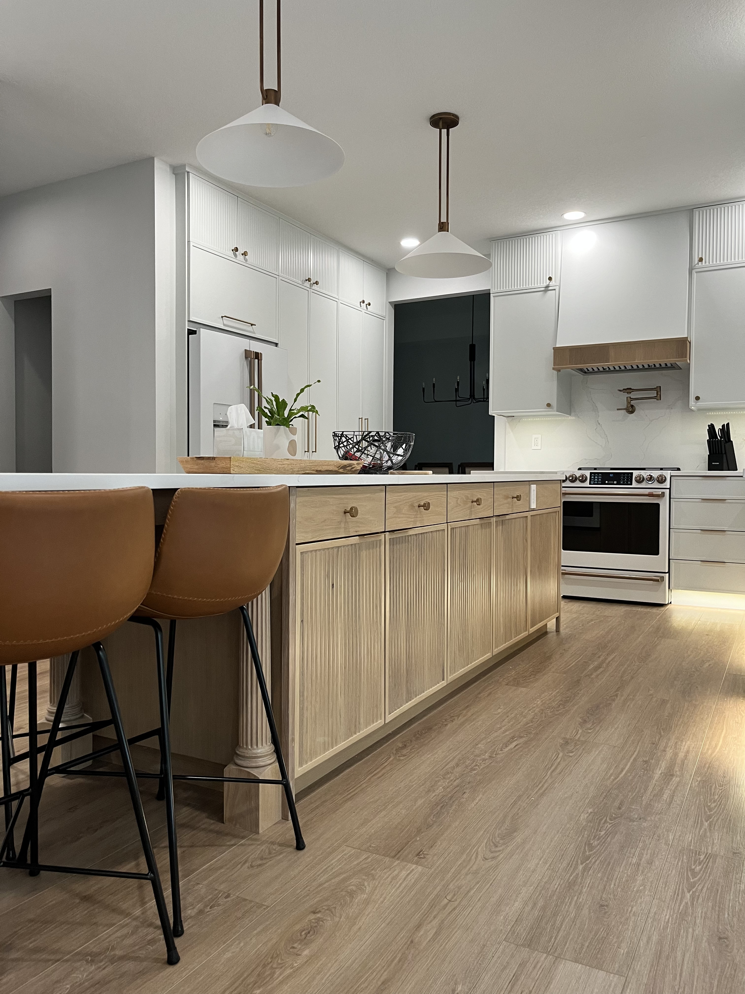 White kitchen with white oak island