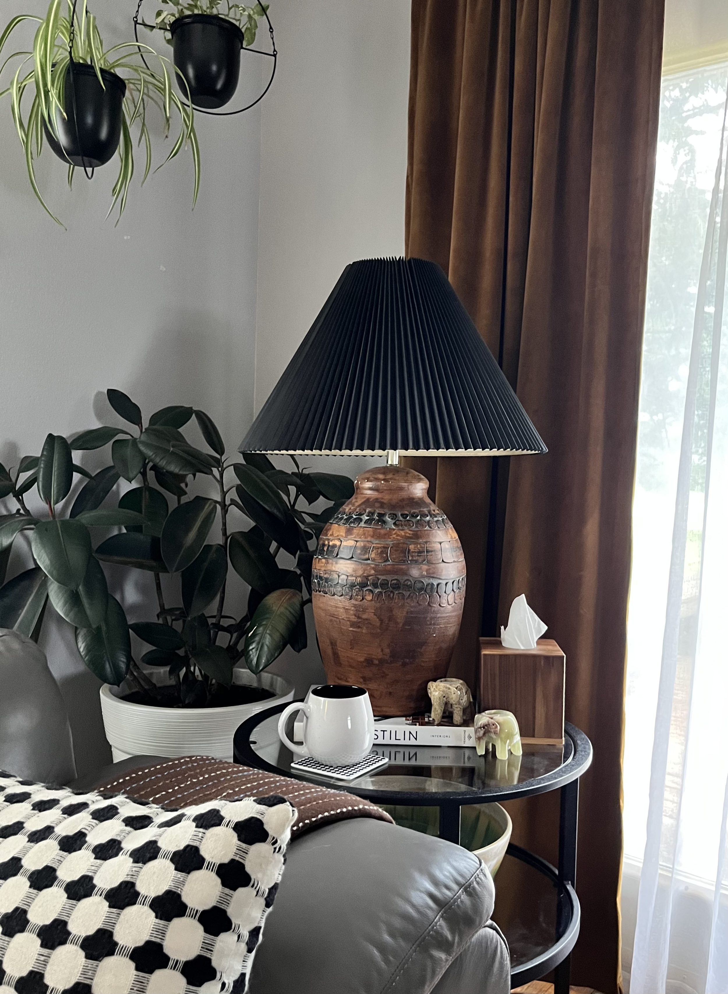 earth tone interior vignette with a large table lamp