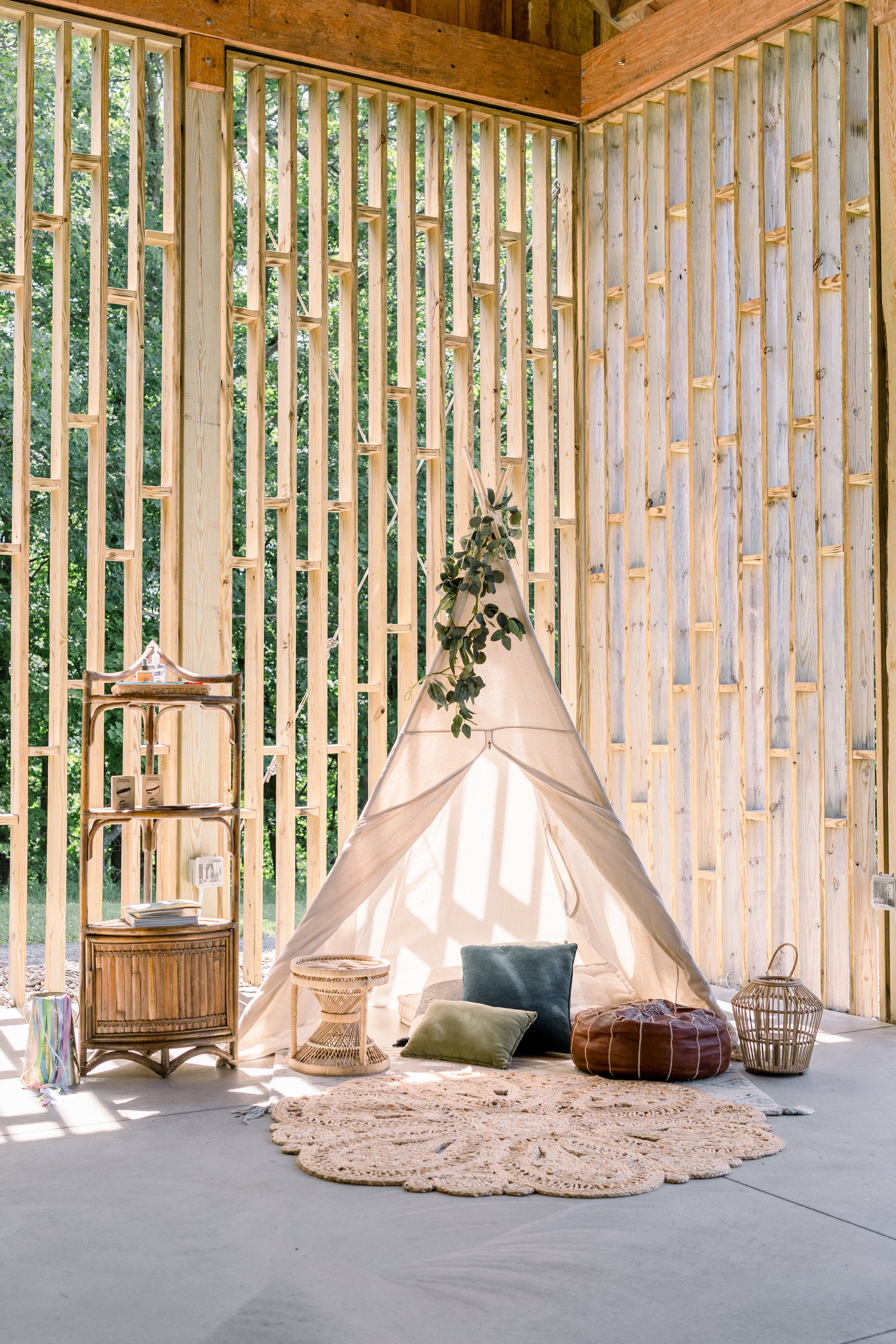 Small teepee with pillows and rugs