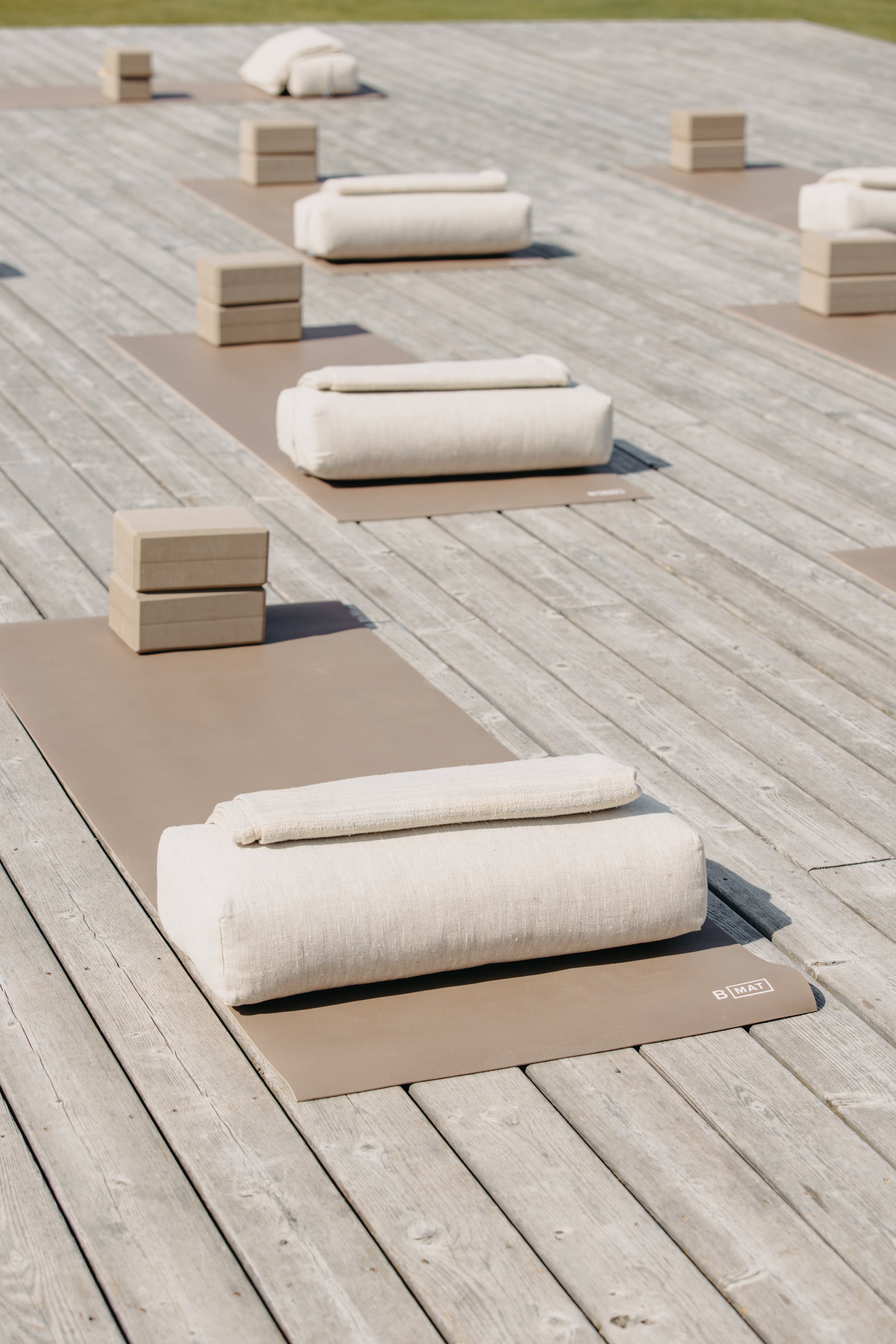 Yoga mats with towels set up outside