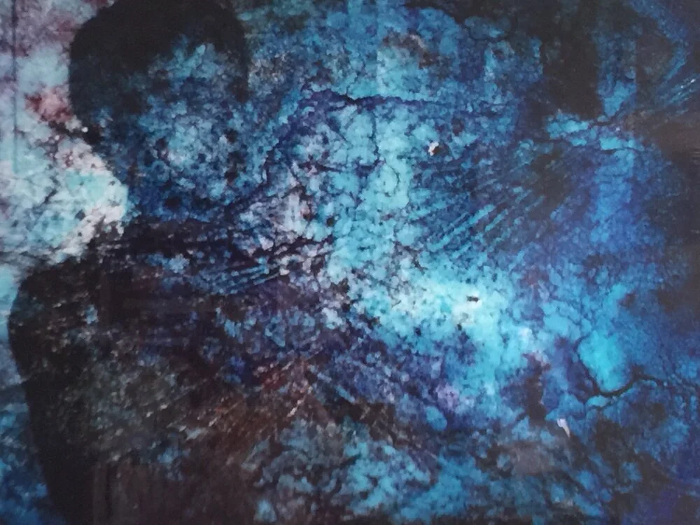 I uncover a slide of myself buried in a mound of earth. Mold eats at the emulsion, creating a chemical reaction.