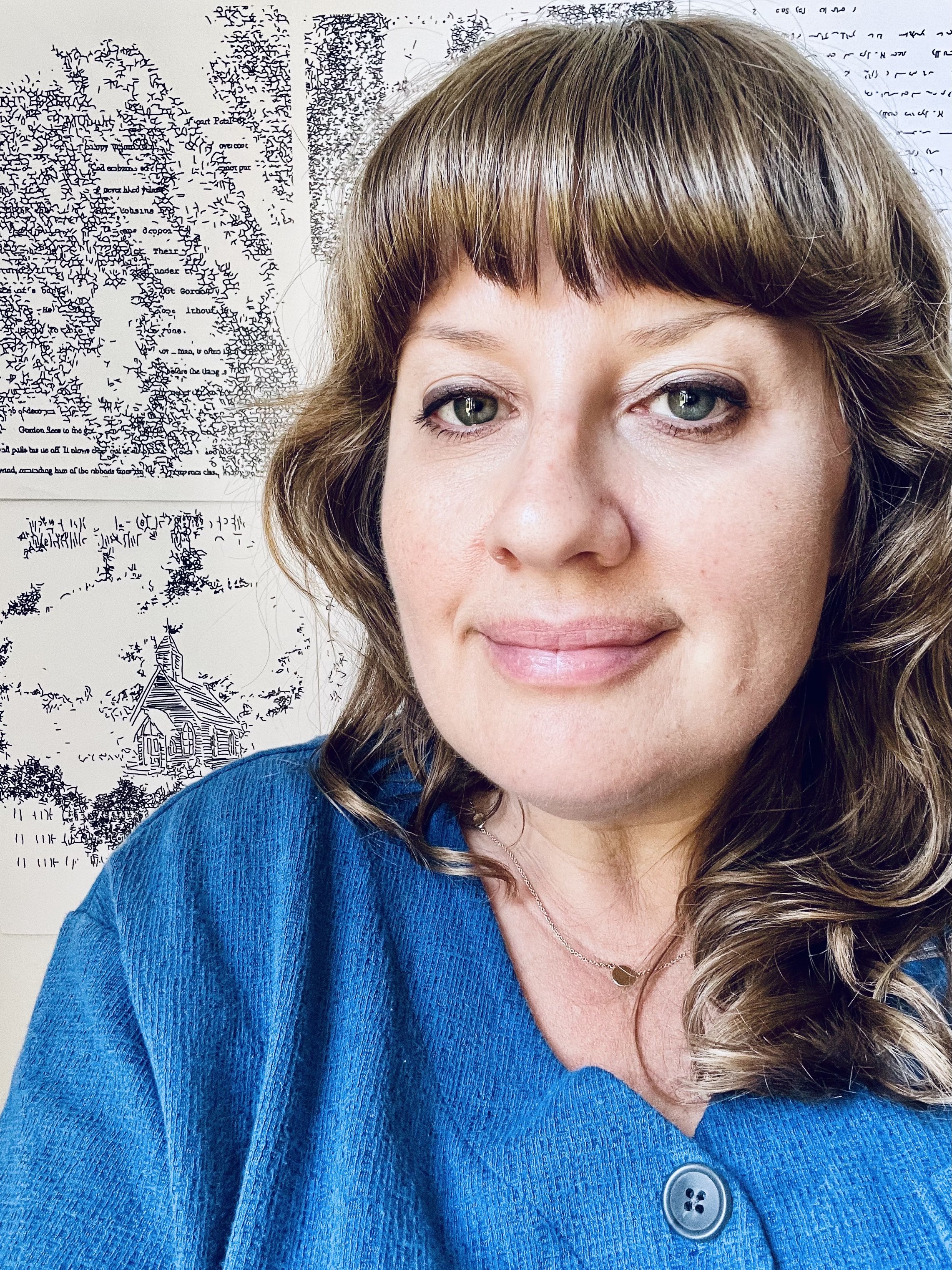 Photo of the artist with her artwork in the background.