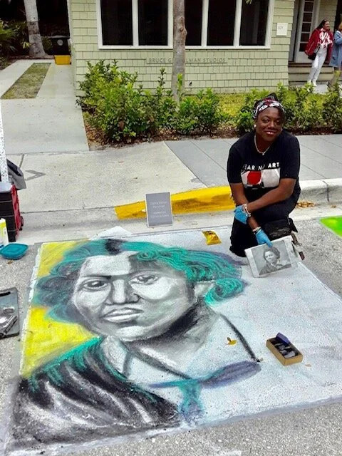Dalhia posing with her in-progress chalk drawing of sculptor Edmonia Lewis