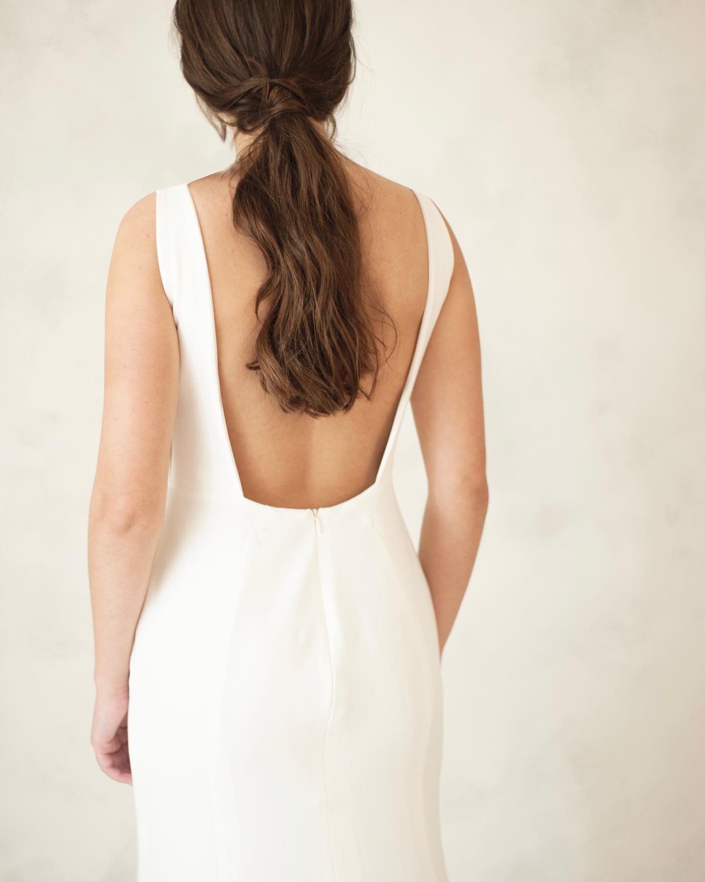 Meet Clara, a sleek open back fit and flare crepe gown with optional removable sleeves | Clara is coming to our upcoming trunk show October 28th to 30th at Yours, by E! 

Clara will be joined with other new gowns being unveiled that weekend! @halifax