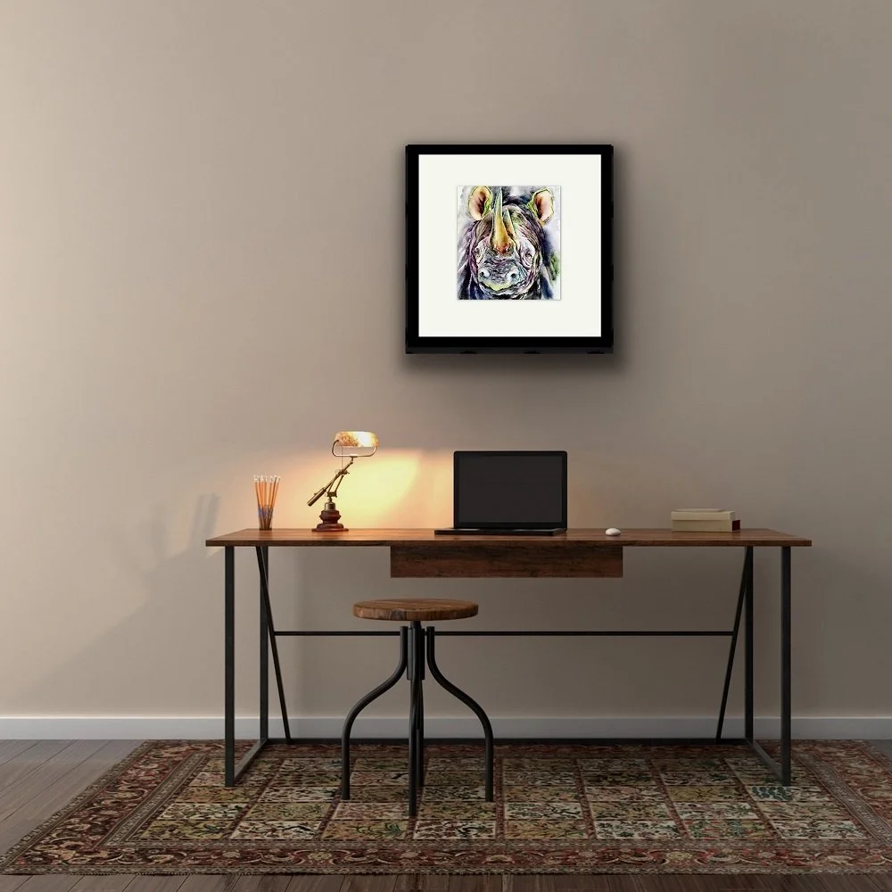 rhino painting by Jos Haigh on brown wall with desk in the foreground