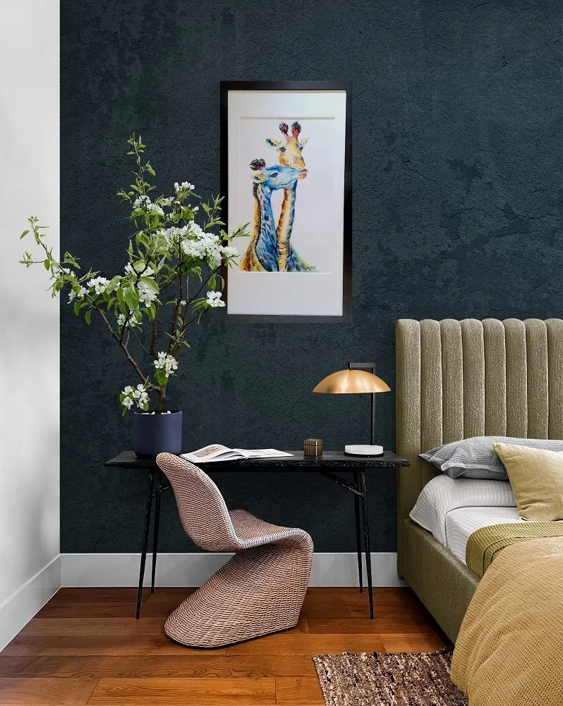 giraffe painting in room on blue wall