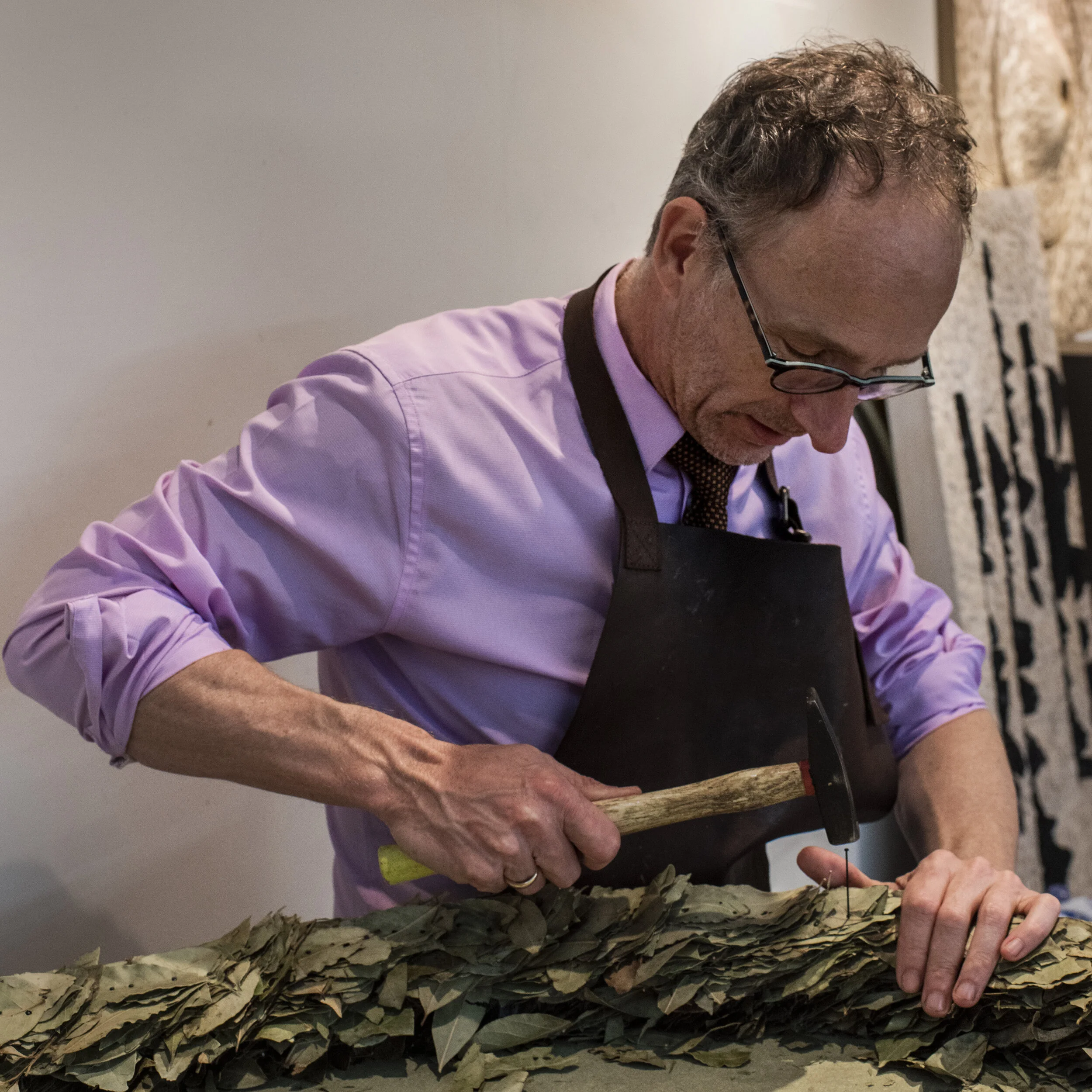 Michel Mullèr at work in his Antwerp studio, making an artwork by hand