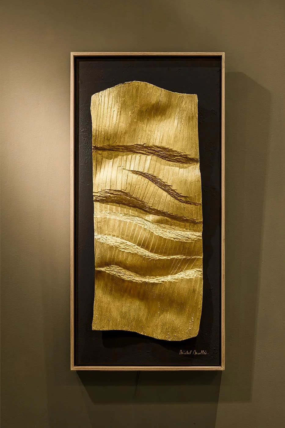 Tall golden relief with wave-like ridges on a black ground in an oak frame, by Michel Mullèr
