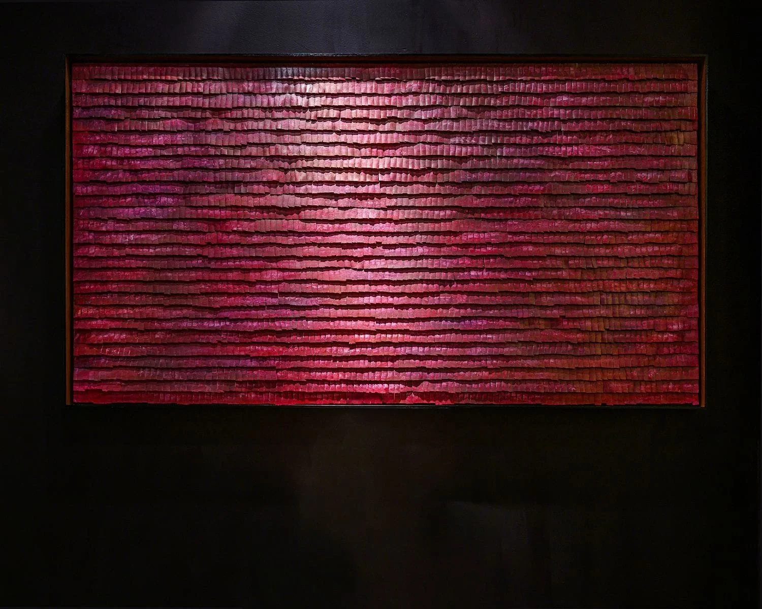 Large deep-red textured wall artwork with layered horizontal rows, by Michel Mullèr