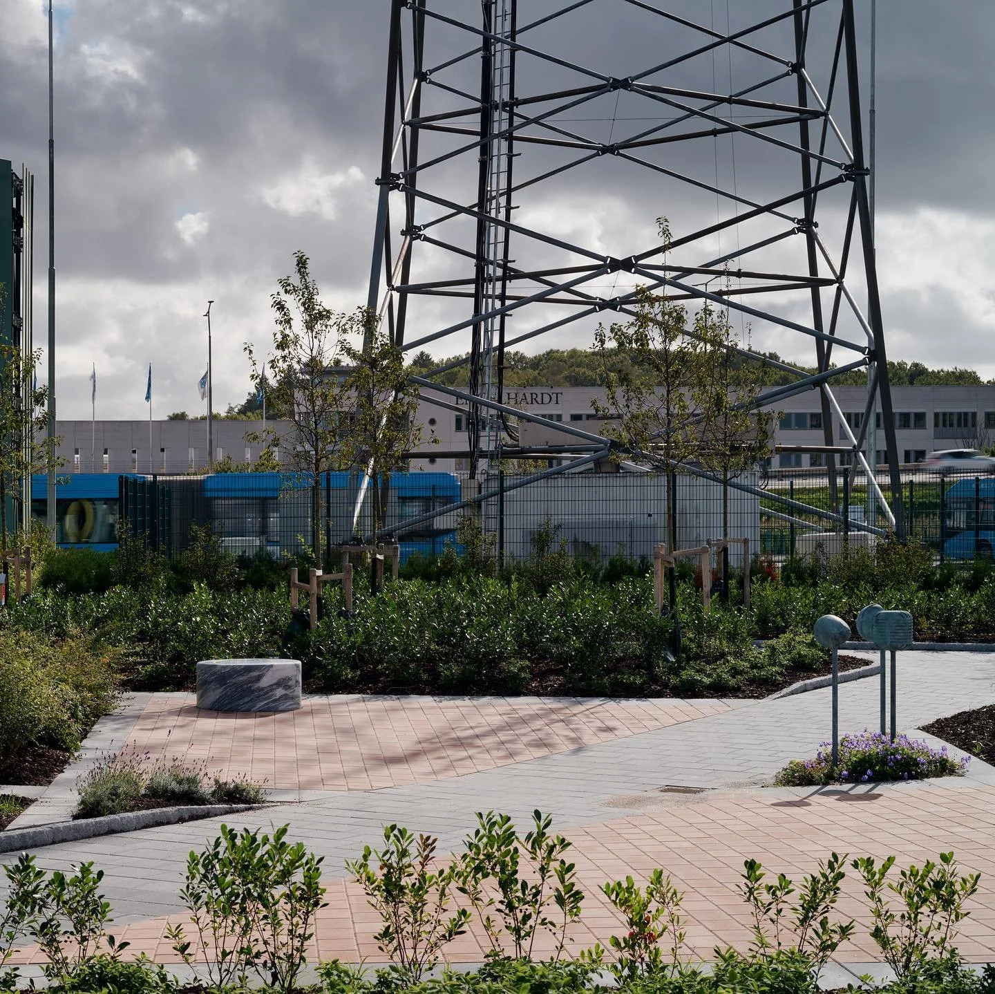 The construction is complete. The artworks The Choir and The Debate from the series The Tones of Time are now surrounded by a planted, tiled outdoor seating area for the employees at the Bus Depot in Gothenburg.

We love the old radio mast which real