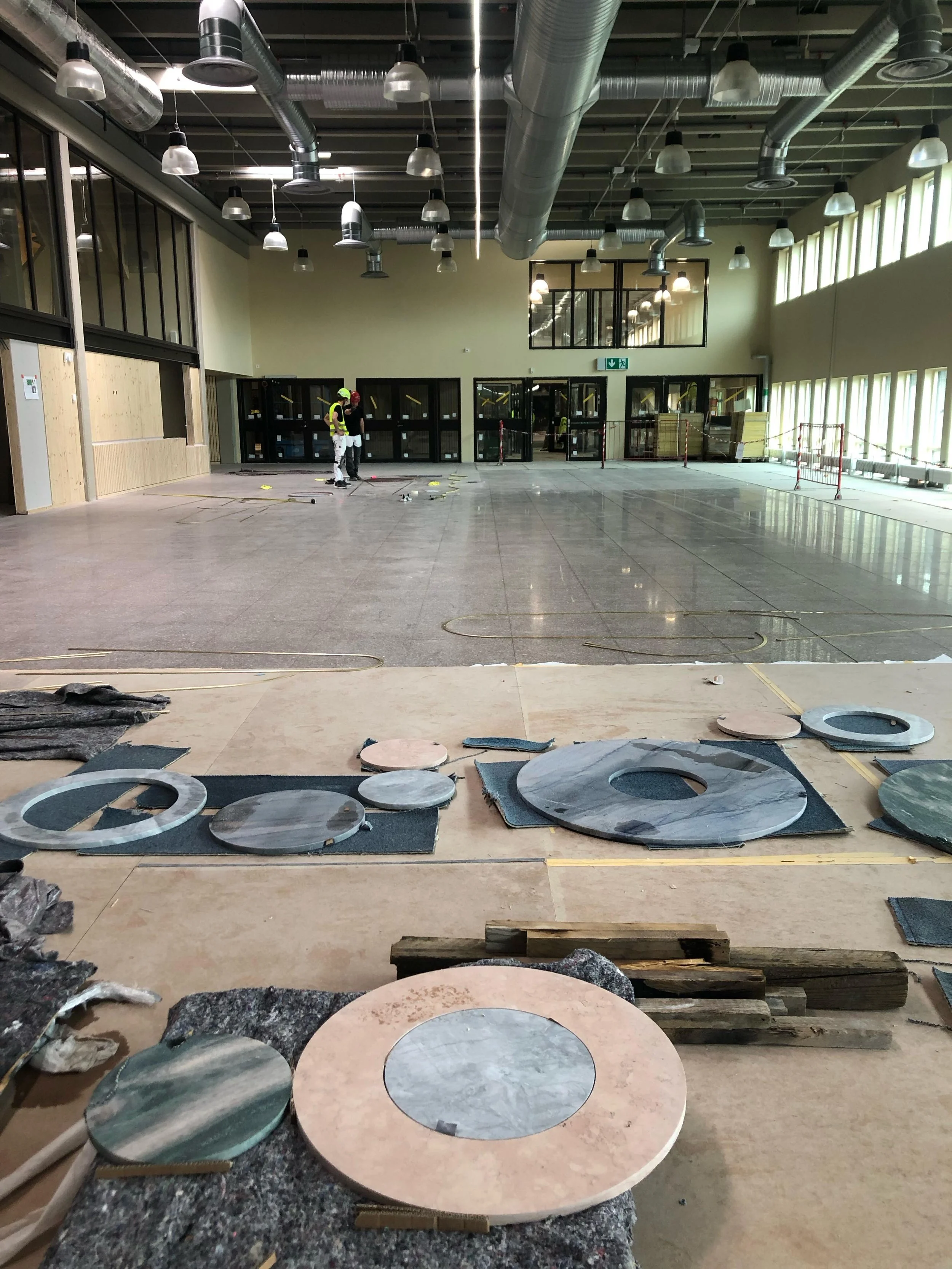 Days of Installation in the entrance hall of the new Ulvsunda Sports Center, Bromma, Stockholm. 
An intarsia in natural stone and brass. The first drawings and measurements. Soon we will start cutting into the terrazzo tiles. 

@bryggerietibromma @pa