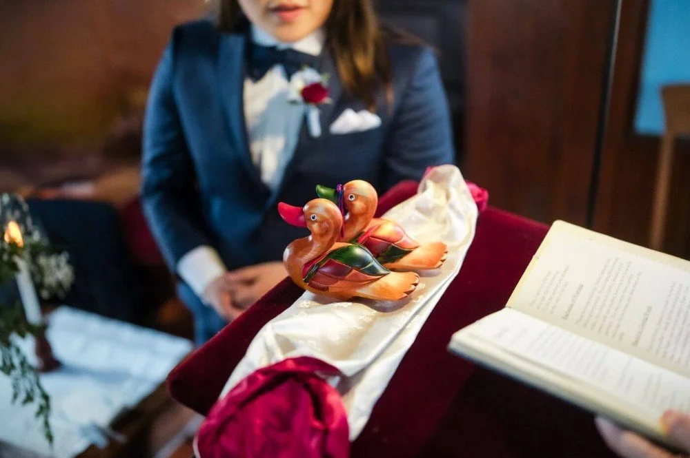 Wooden won-ang displayed before the exchange in a modern Korean-inspired queer wedding.