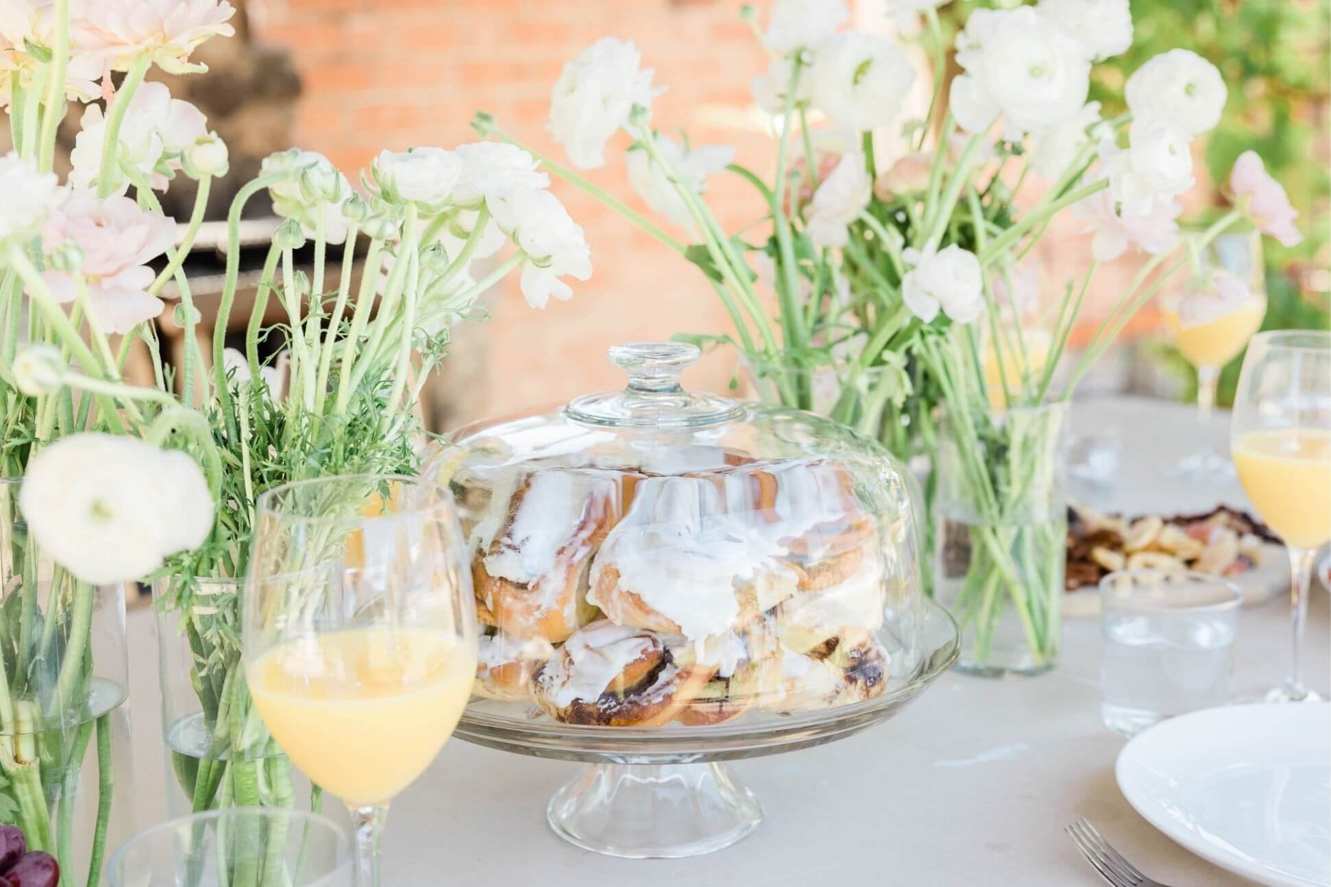 Brunch wedding table in Philadelphia with pastries and white flowers.