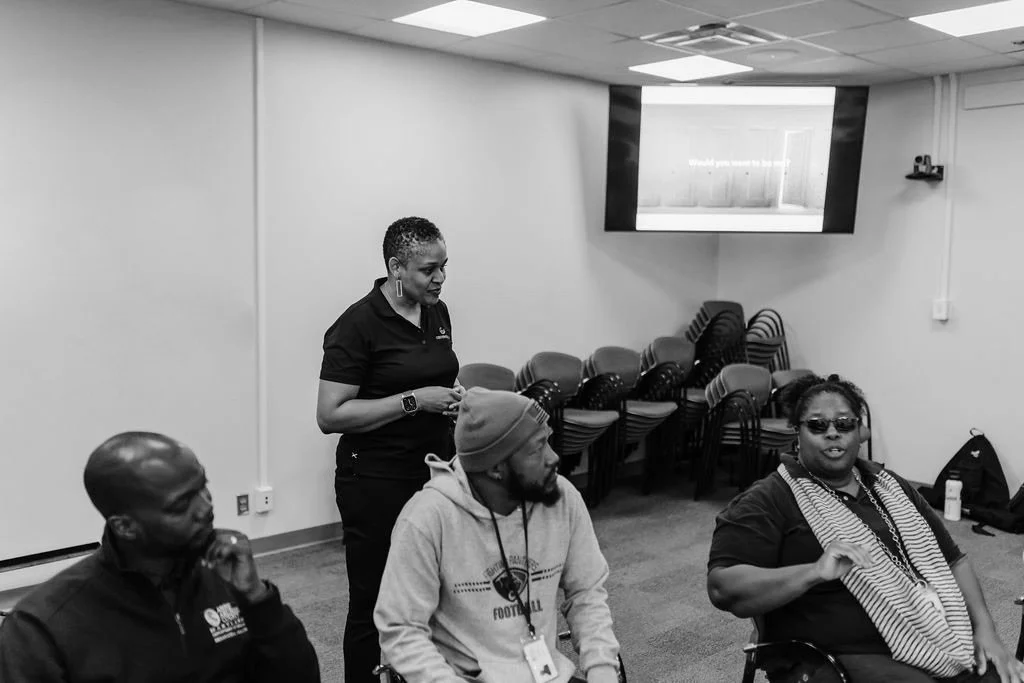 3 people that are being coached in a workshop