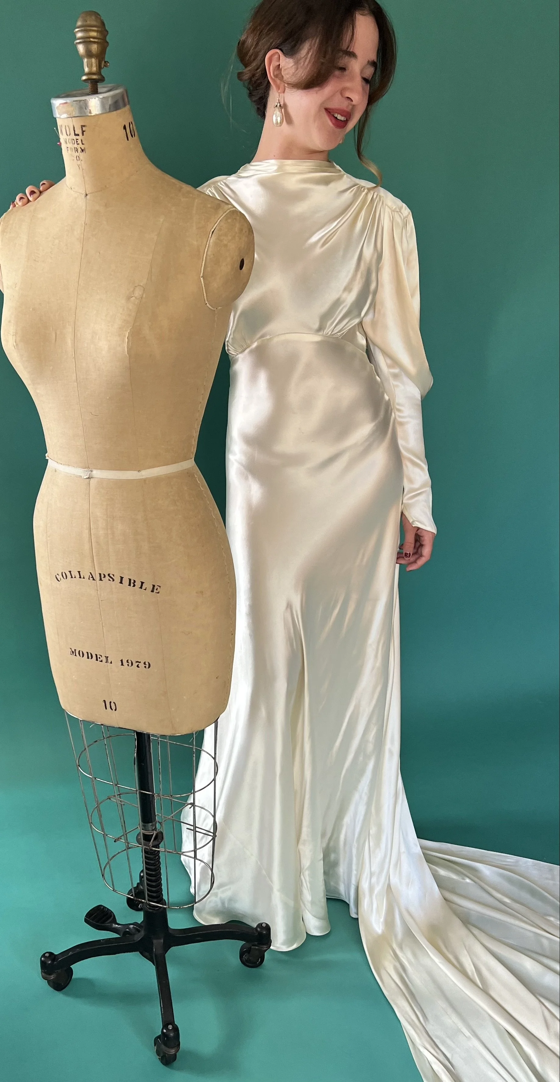 Bride wearing a vintage couture 1930s dress above comments from a bridal stylist.