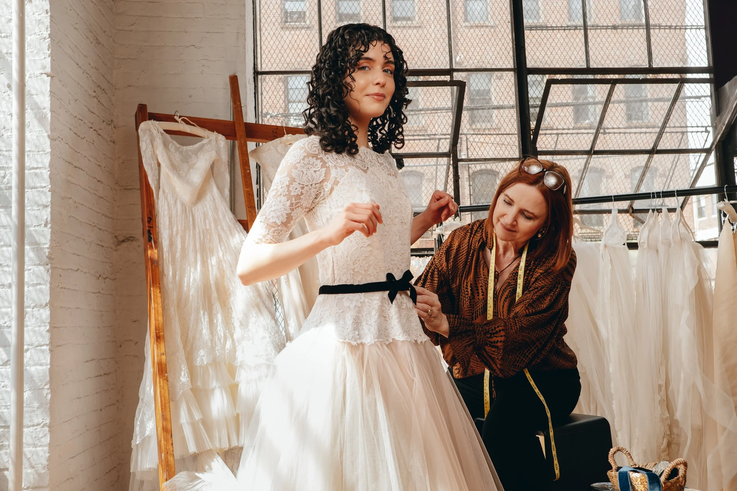 Bride working with vintage wedding gown designer Christine Carlson of Maybelle NYC.