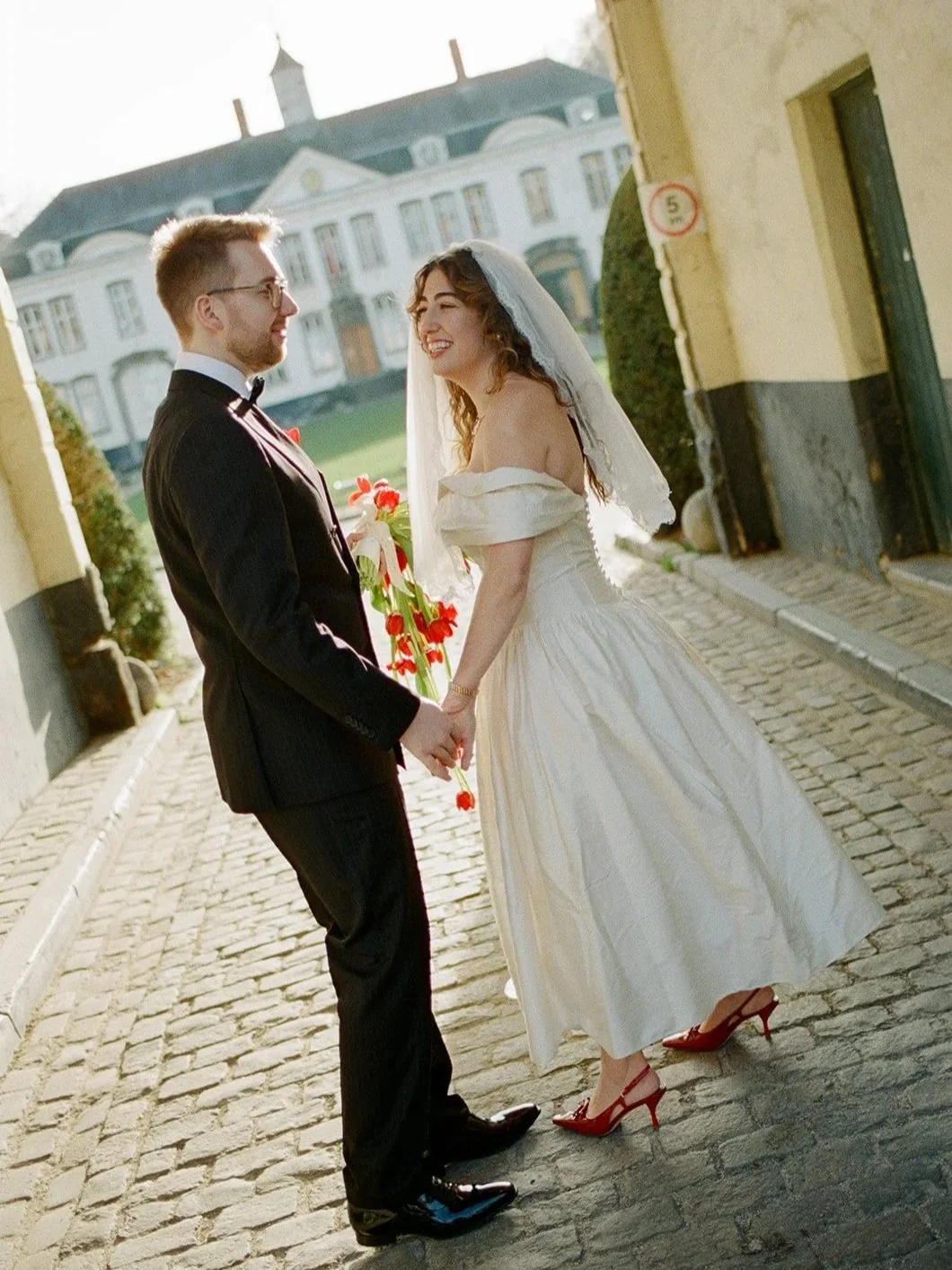 Bride wearing a vintage wedding dress restoration from Maybelle.