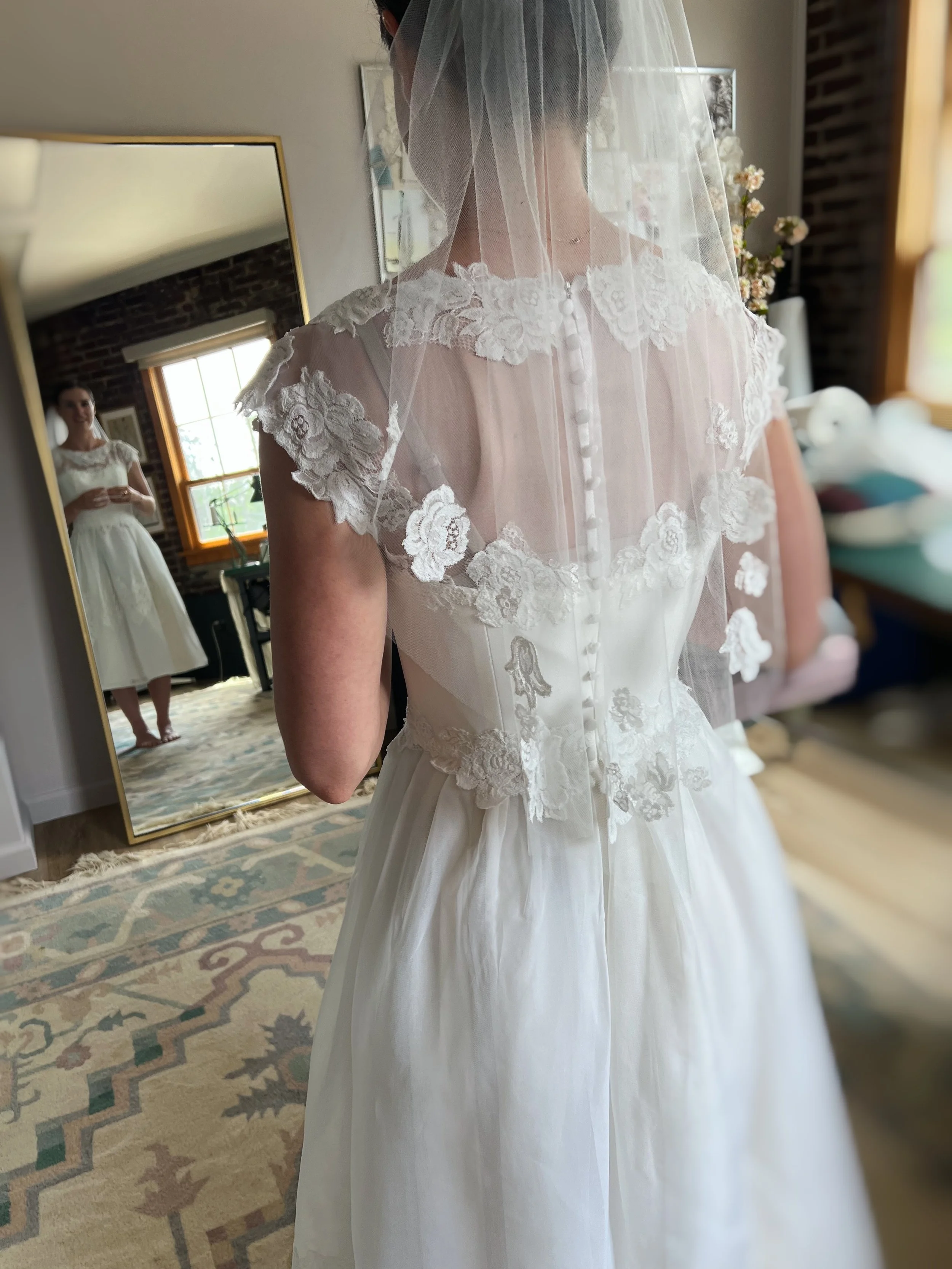 Bride wearing her redesigned grandmother's wedding dress, by Maybelle.