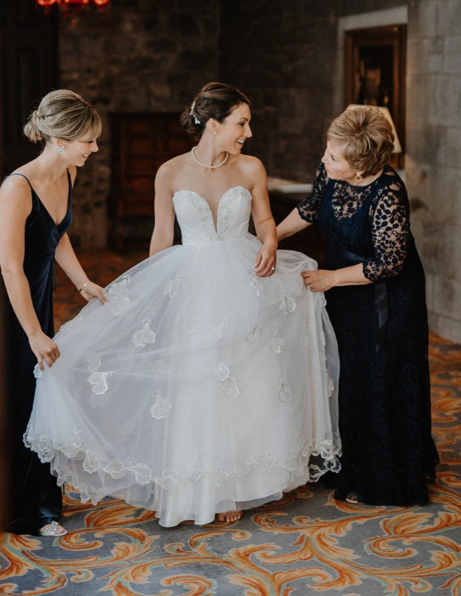 Bride in strapless vintage wedding dress, restoration by Maybelle.