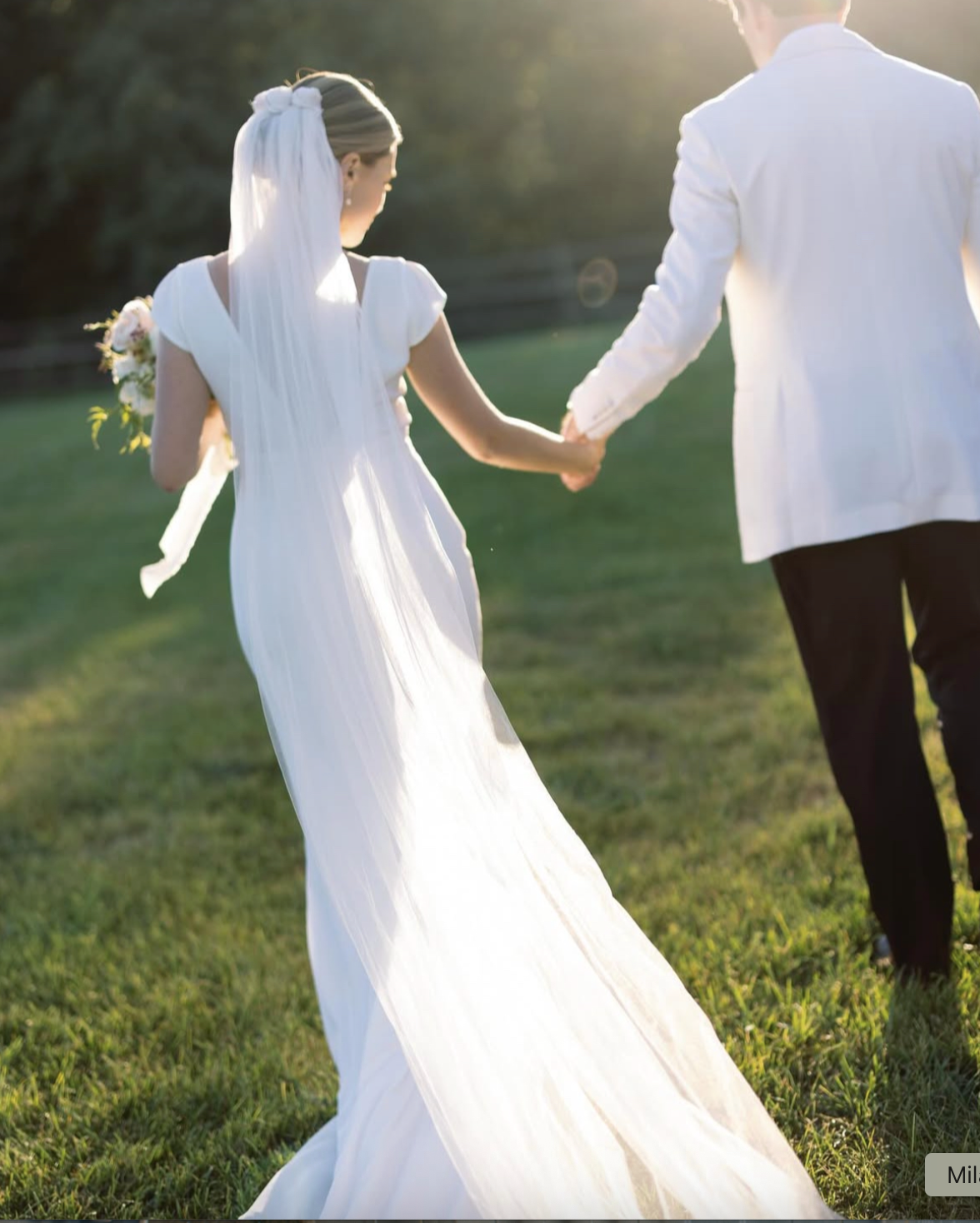 Bride wearing long vintage veil from Maybelle.