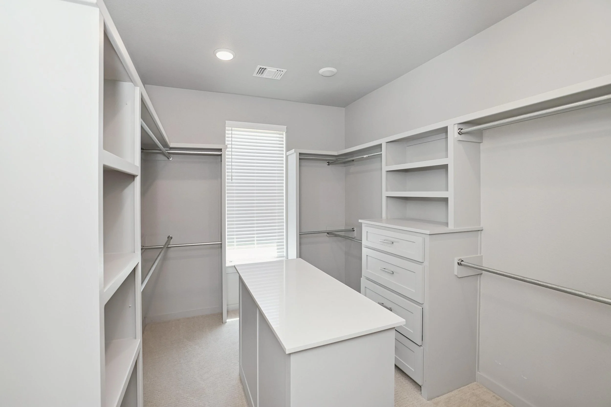 17-Primary Closet Hers.jpg