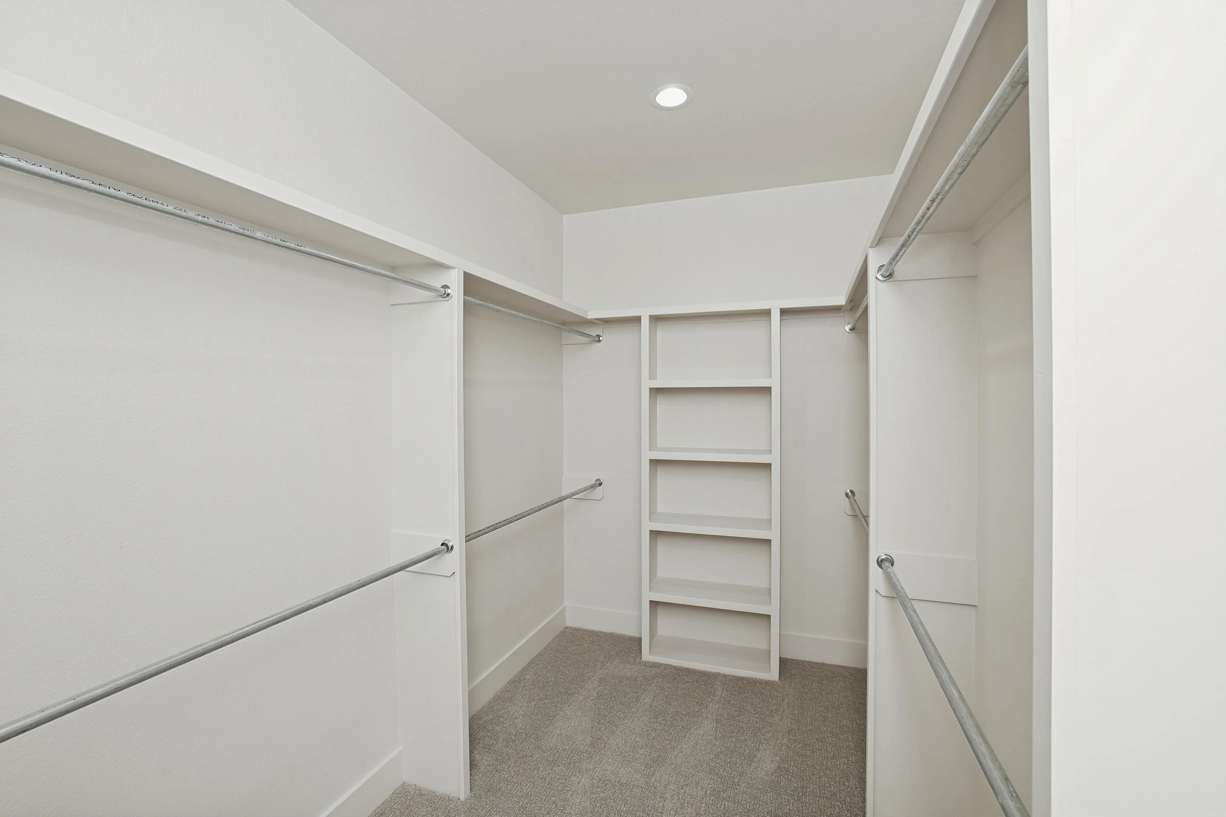 17-Primary Closet Hers.jpg