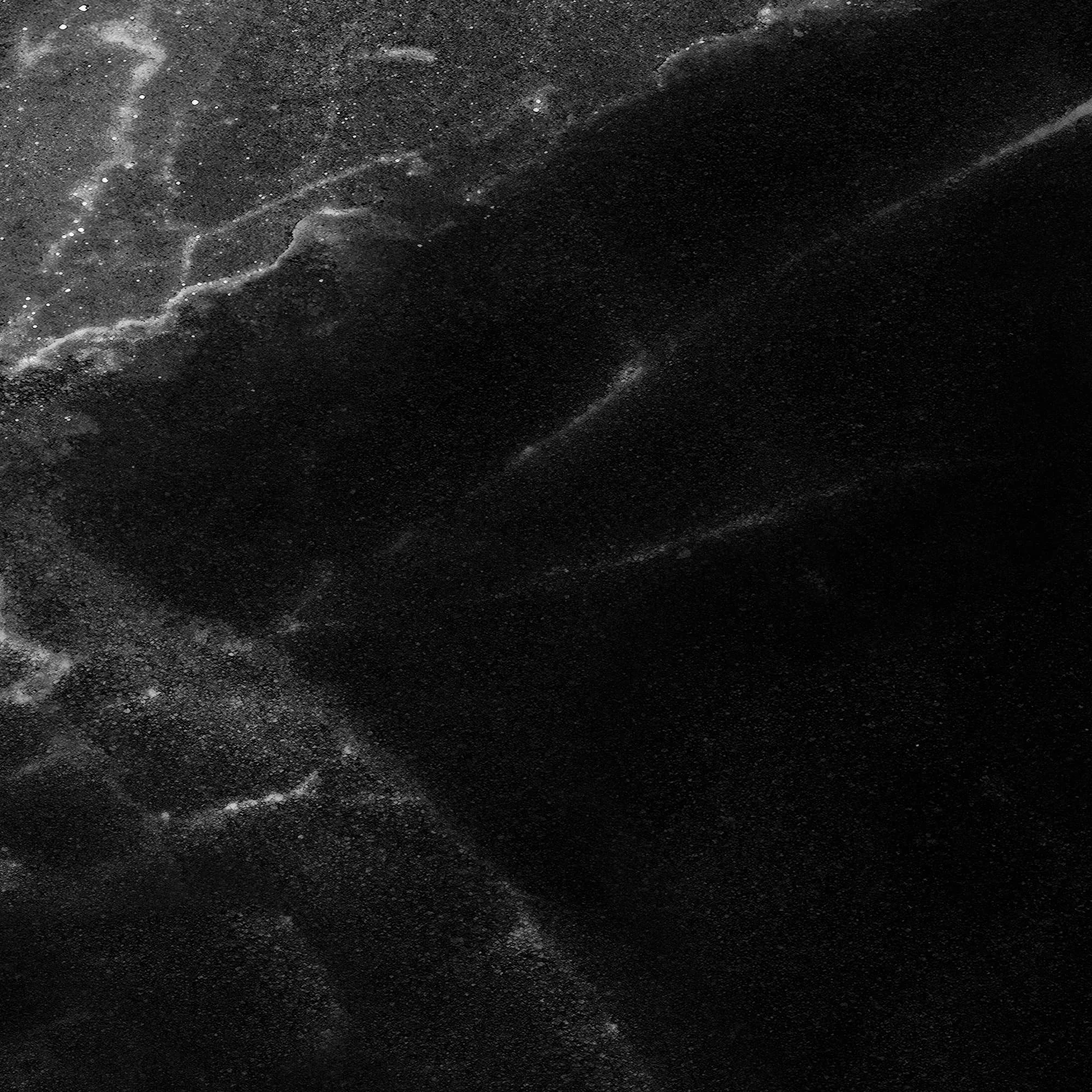 Very close up screenshot of our black carrara marble texture, showing the level of detail in the graphic.
