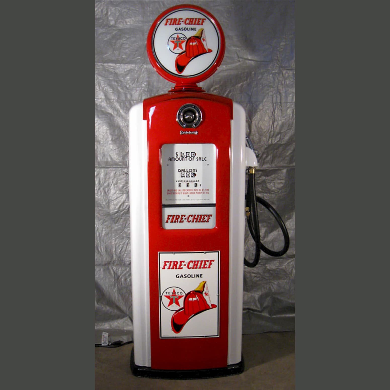 photo of a restored Bennett Texaco Fire-Chief gas pump that our vinyl wrap design is based on