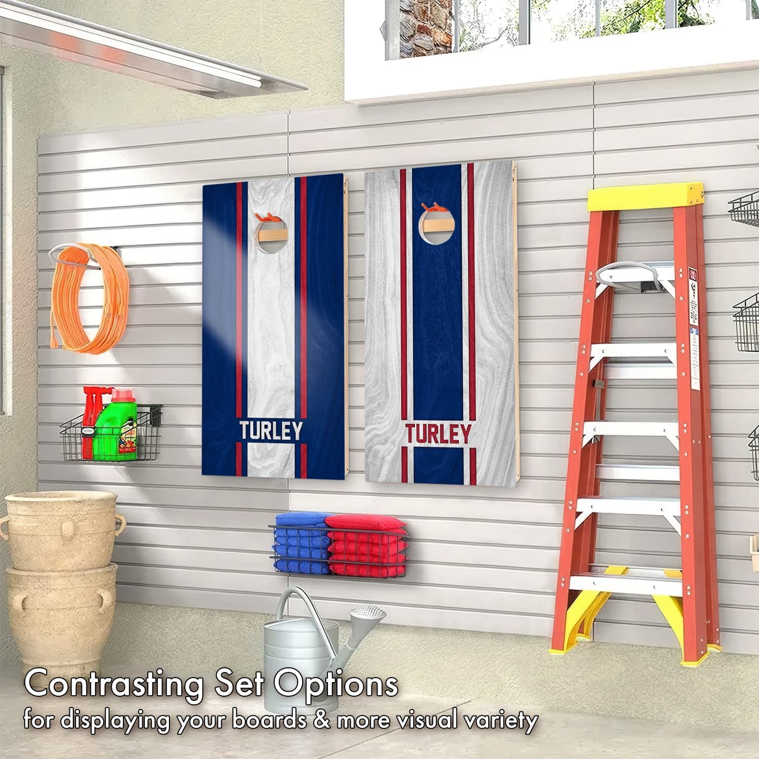 Contrasting set of Personalized New York Giants Colors custom wood Cornhole boards hanging on display in a garage