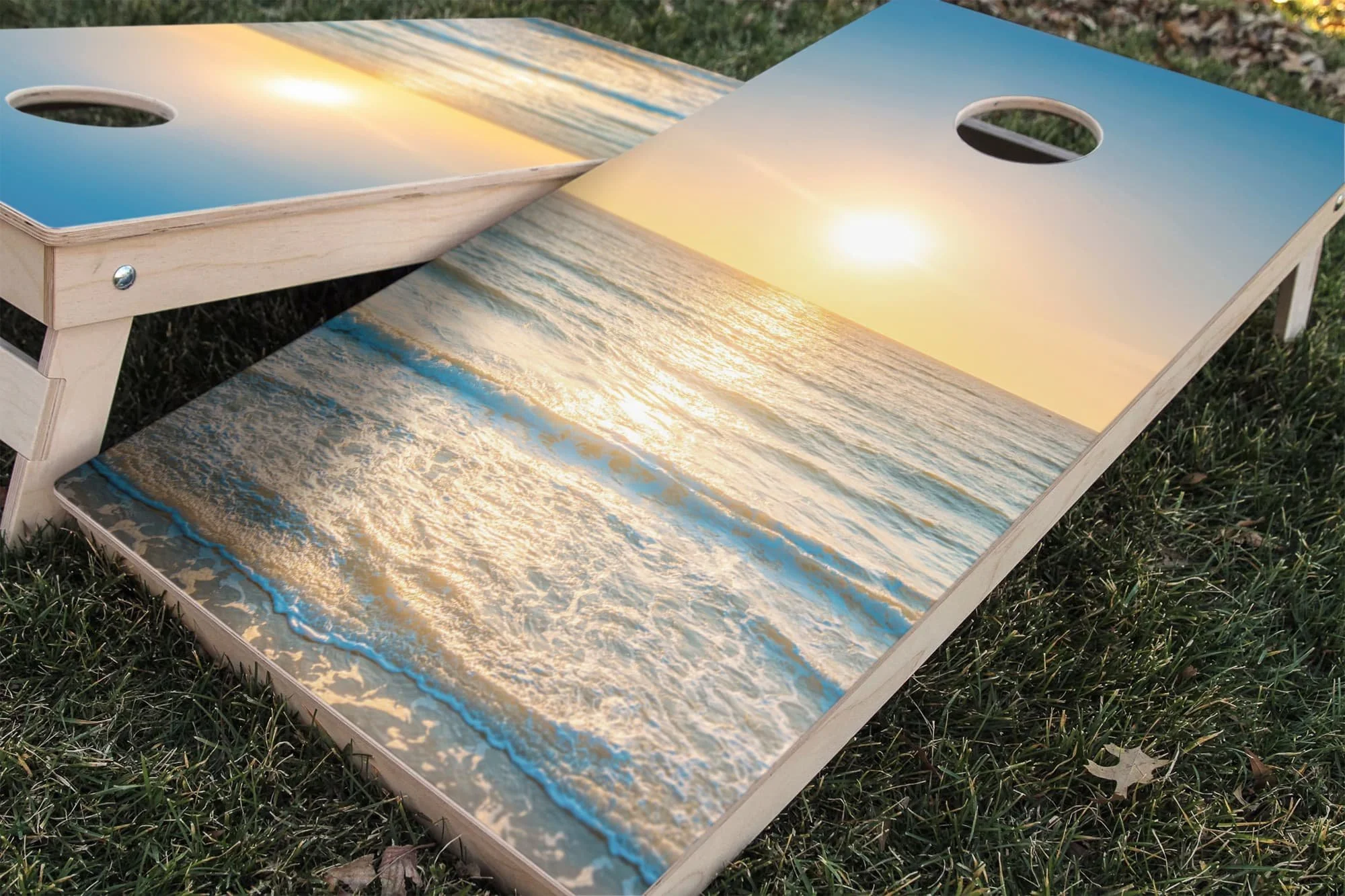 pastel yellow and blue sunrise over ocean waves Cornhole board wrap sticker decal set