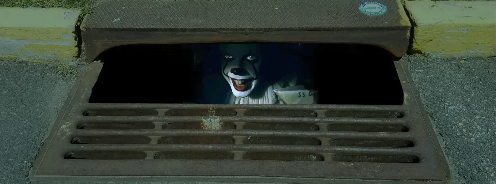 Pennywise in the Sewer Drain bottom of door