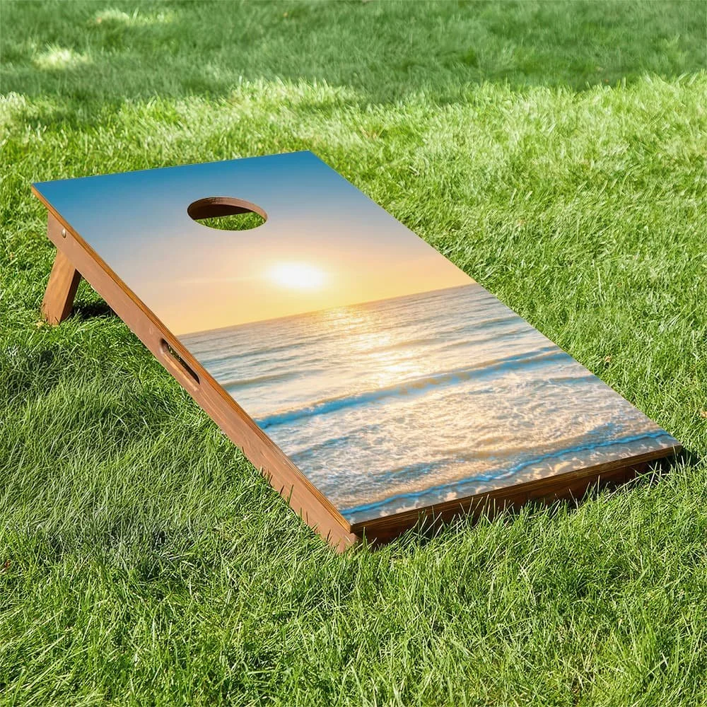 pastel yellow and blue sunrise over ocean waves Cornhole board