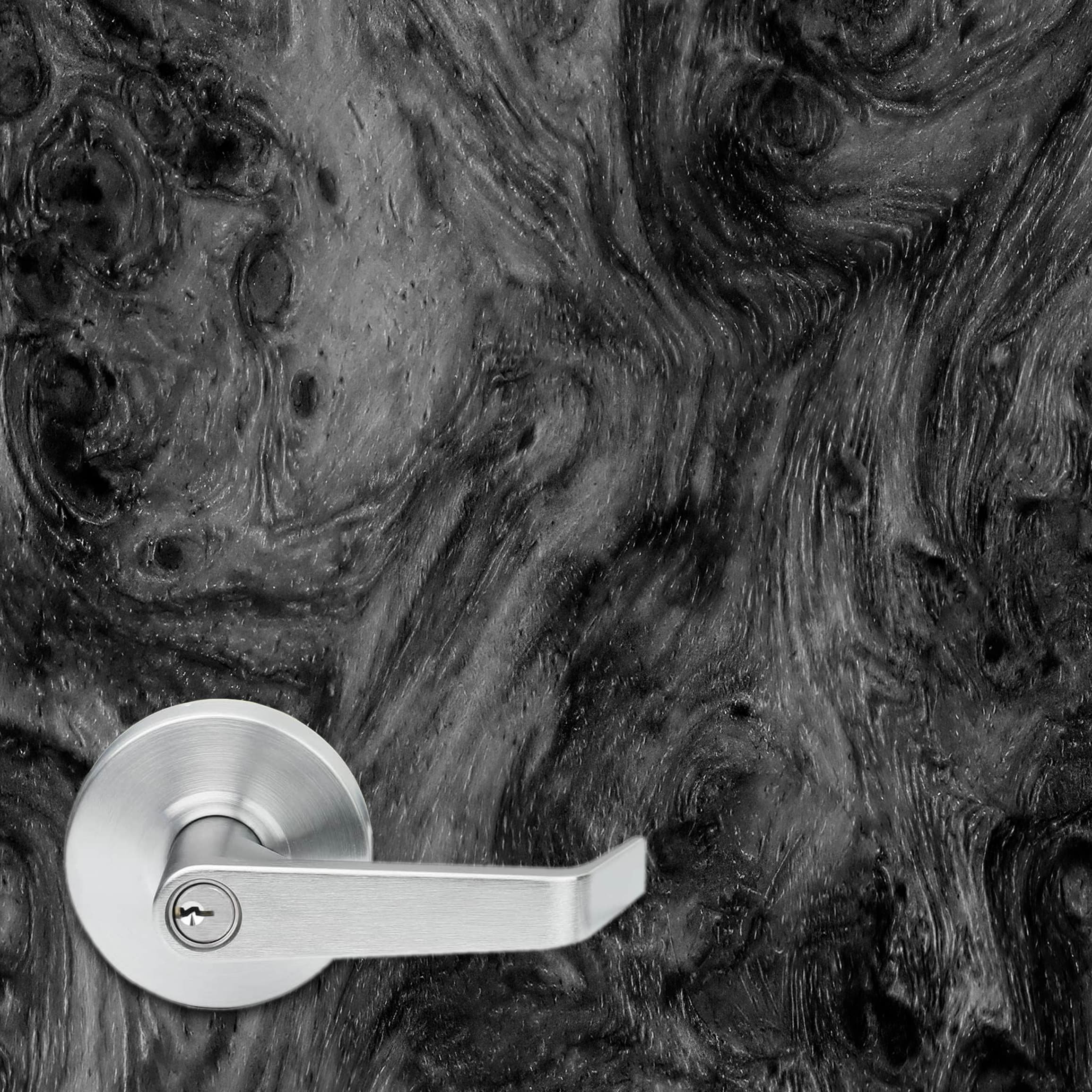 Close up of a high resolution amboyna burl wood texture vinyl door wrap. A typical 5.375" office door handle is shown to give a sense of scale and to show the detailing in the wood texture.