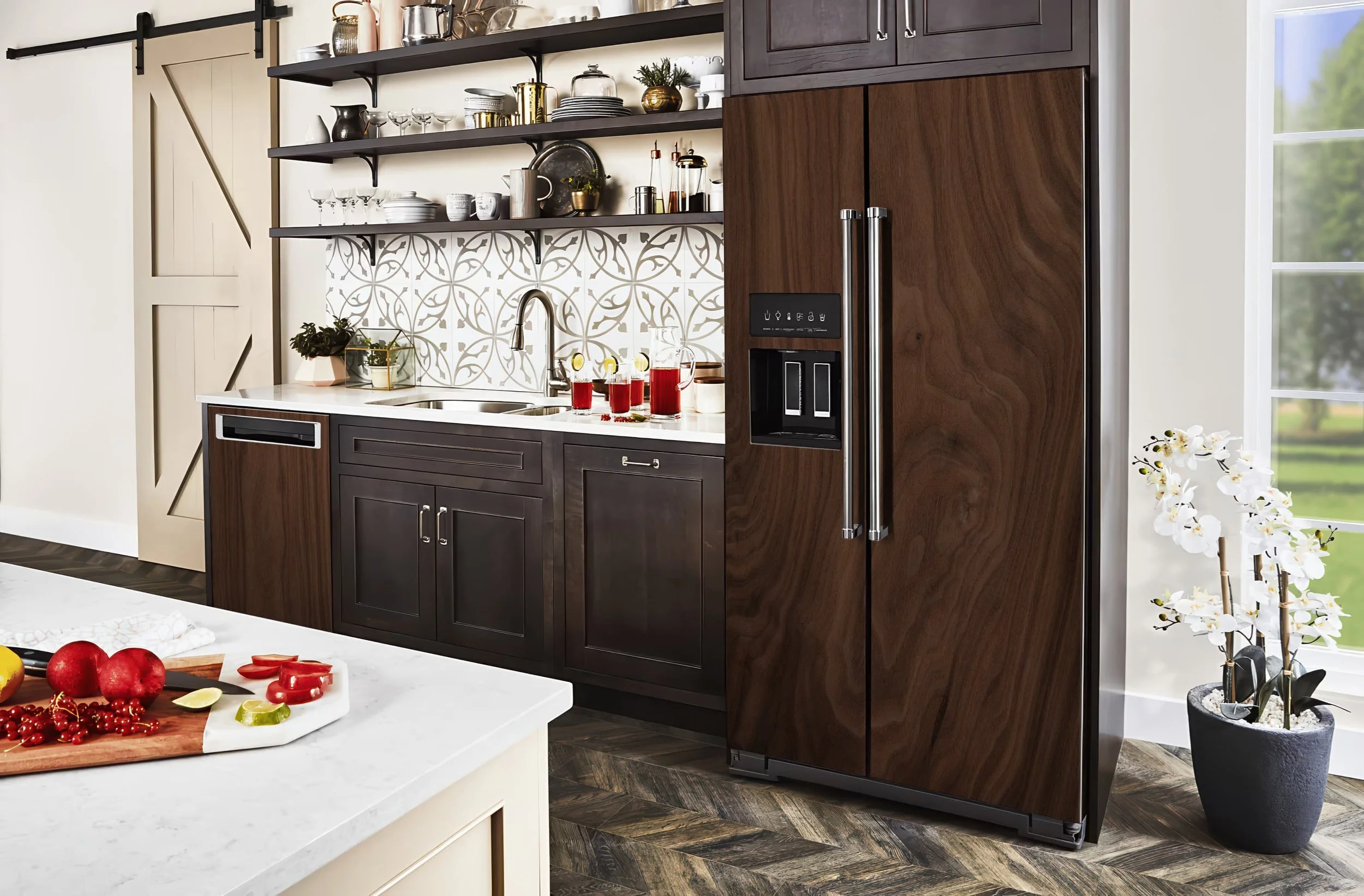 A side-by-side style refrigerator in a modern kitchen shown wrapped with a dark walnut wood slab custom-printed vinyl skin.