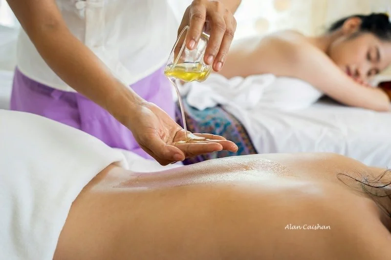 Two women receiving a massage.