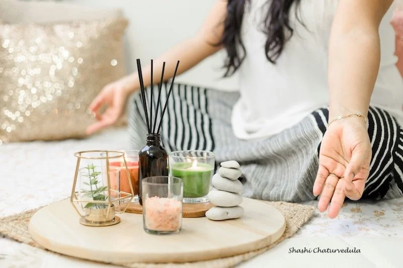 A woman meditating.