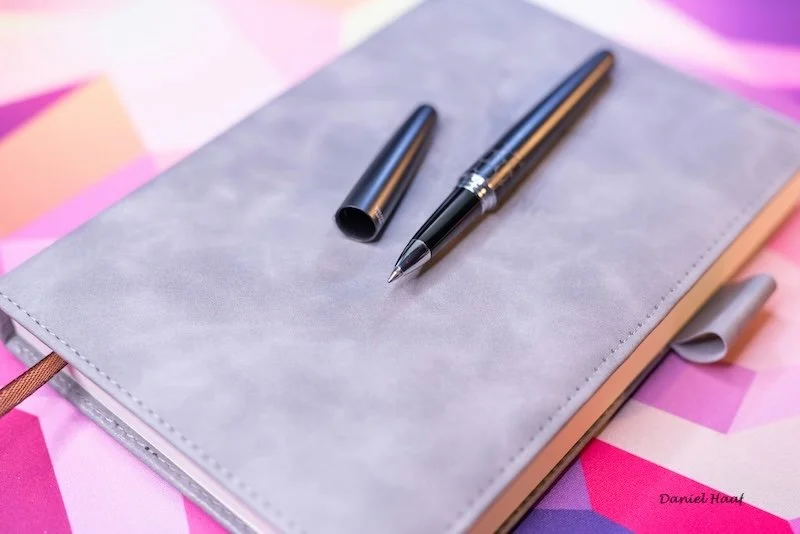 A journal and fountain pen.