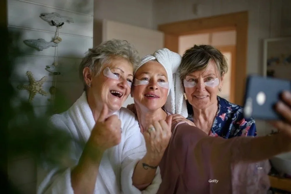 Three women over 55 giving themselves a spa day as they show their self-love.